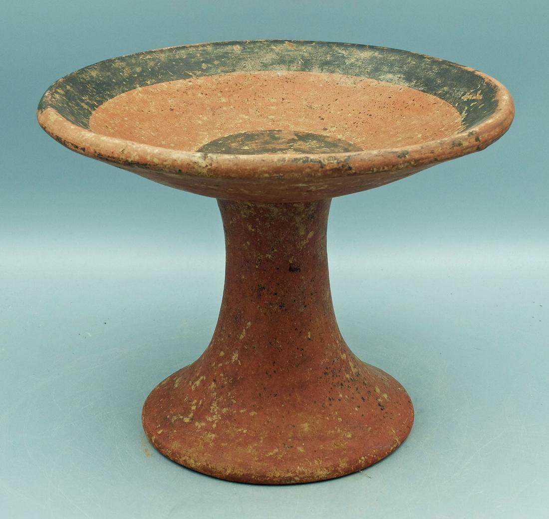 Ciruelo Black-on-Red Bi-Chrome Pedestal Plate: A rare Ciruelo black-on-red Bi-chrome pedestal plate from the Tonosi area of Panama, ca. 900 - 500 BC. This superb Zahina Polychrome example is 7 in. high, 8-1/2 in.in diameter and is decorated with s