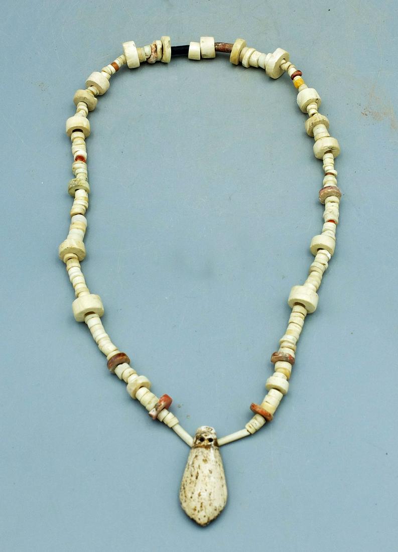 Sinu Shell Necklace - Colombia: A nice Sinu shell necklace from Colombia, ca, 1000 - 1500 AD. It is 18 in. long, is comprised of a variety of white shell and Spondylus beads and featured a 1-1/4 in. long pendant. (B232)