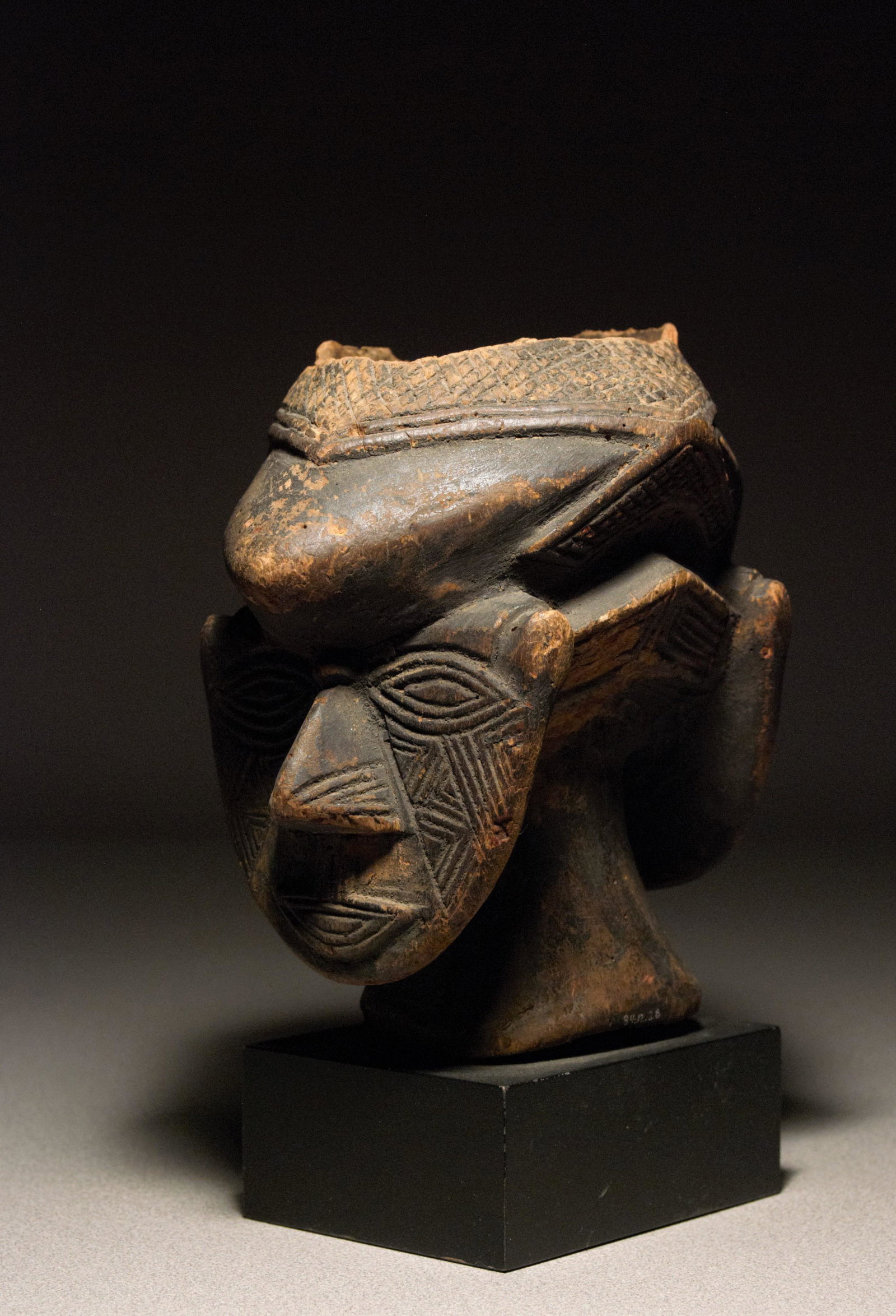 20th C. Janiform Effigy Mortar - Kuba Peoples: Janiform effigy mortar Kuba peoples D.R.Congo, Central Africa Early 20th century Wood In good condition; this is a well-used and early example showing old losses and wear along the high point areas. O