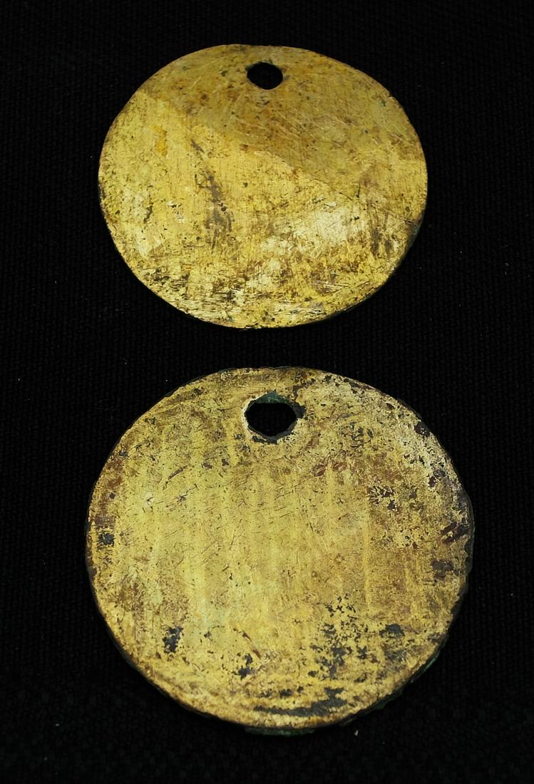 Pair of Vicus Gilt Pendants - Peru: A pair of Vicus gilt pendants from Peru, ca. 200 BC - 200 AD. They are 1-1/2 in. and 1-5/8 in. in diameter, in excellent condition and show strong mineral deposits. Mounted in Riker box. Cf. De Lavall