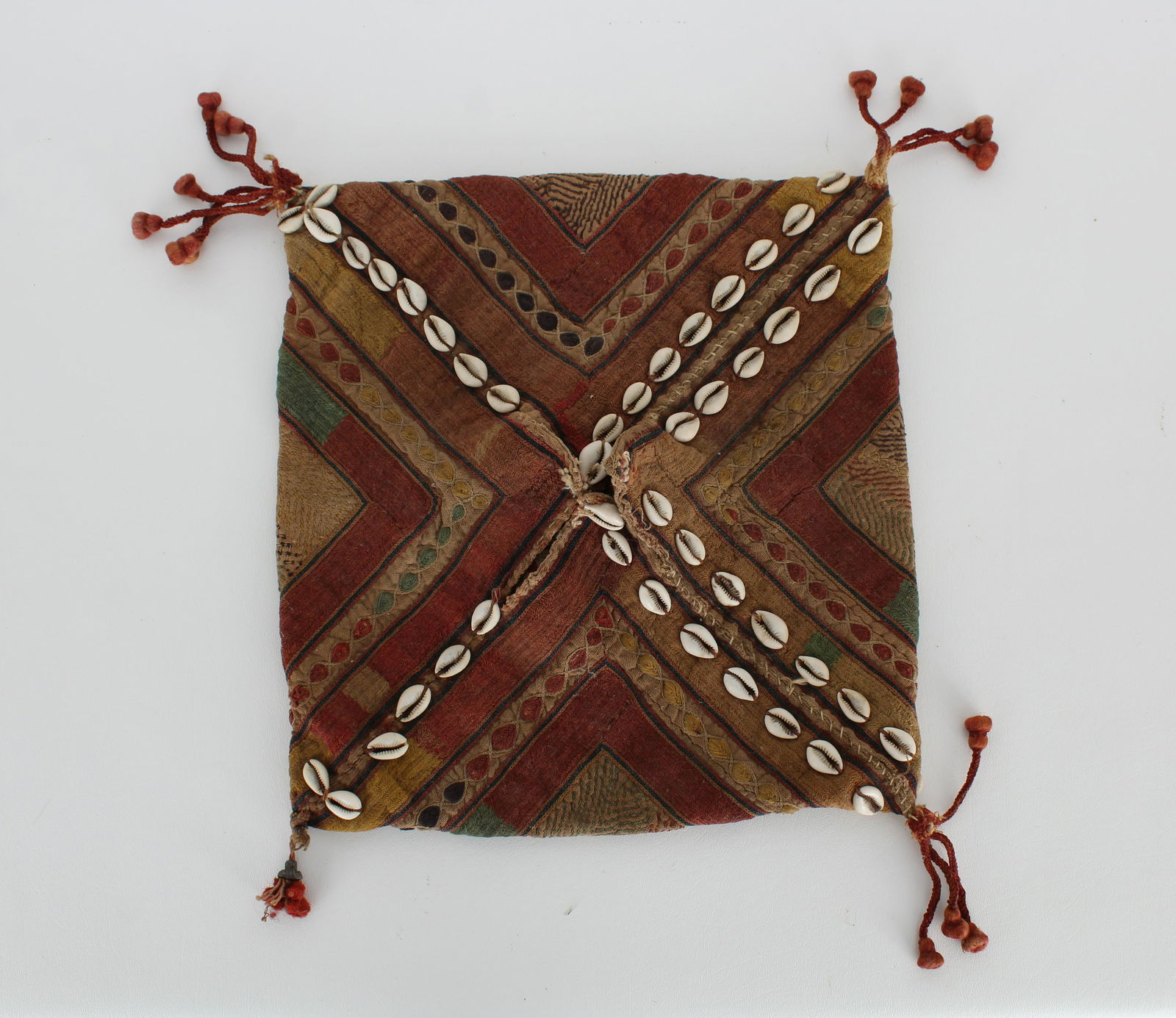 Caucuses Saddle Bag Pouch - Eurasia: Saddle bag pouch Caucuses Eurasia 19th Century Wool with organic dyes and cowrie shells In very fine condition with excellent preservation and fresh colors; supple and strong. Some minor losses to fri