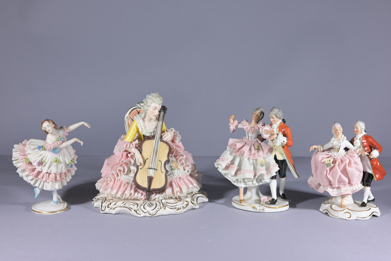 (4) Dresden Porcelain Lace Figurines: (4) Dresden Porcelain Lace Figurines. All marked on base. Total Height: 9.5 in.