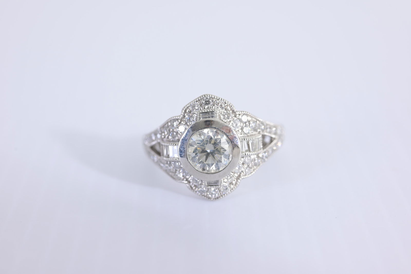 Platinum Diamond Ring: Platinum Diamond Ring. Having 0.9ct round cut center stone surrounded by 54 smaller diamonds with a total weight of 0.7ctw. Comes with EGL USA diamond report along with AIGL Appraisal Approx. Total We