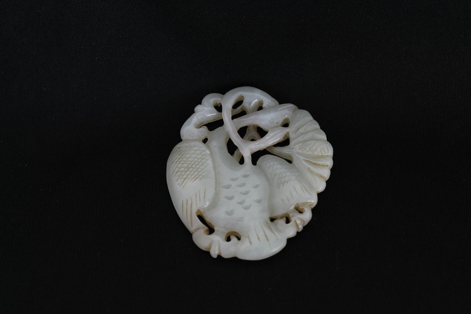 Chinese Jade Pendant of Swan: A Chinese jade pendant of swan and lotus. Provenance: Private Montreal, Canada estate. Size: 2 3/8 x 2 1/8 in.