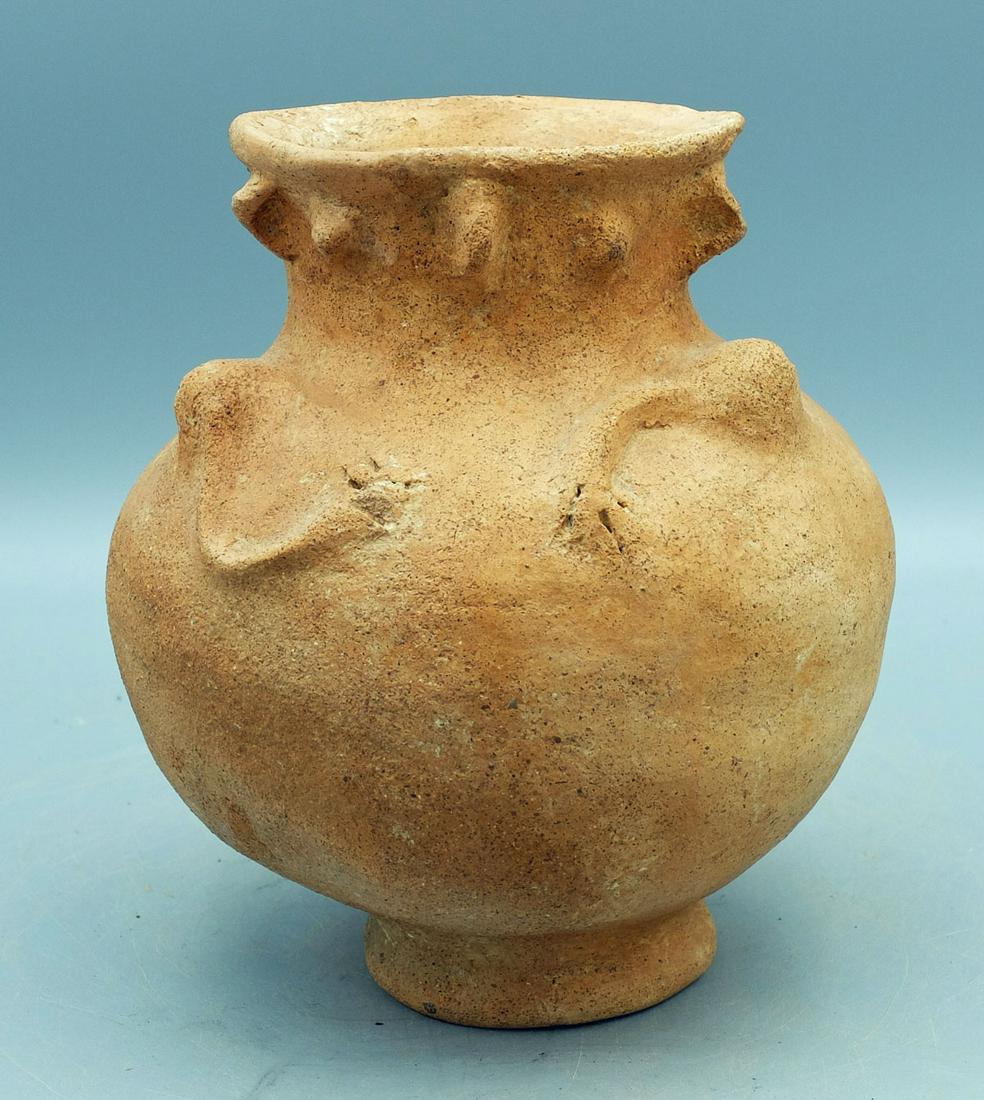 Unusual Figural Vessel from Panama: An unusual figural vessel from Panama, ca. 1000 - 1500 AD. It is 6-1/2 in. high, 5-1/2 in. in diameter and depicts an individual with spindly arms reaching over his chest. The facial features are appl