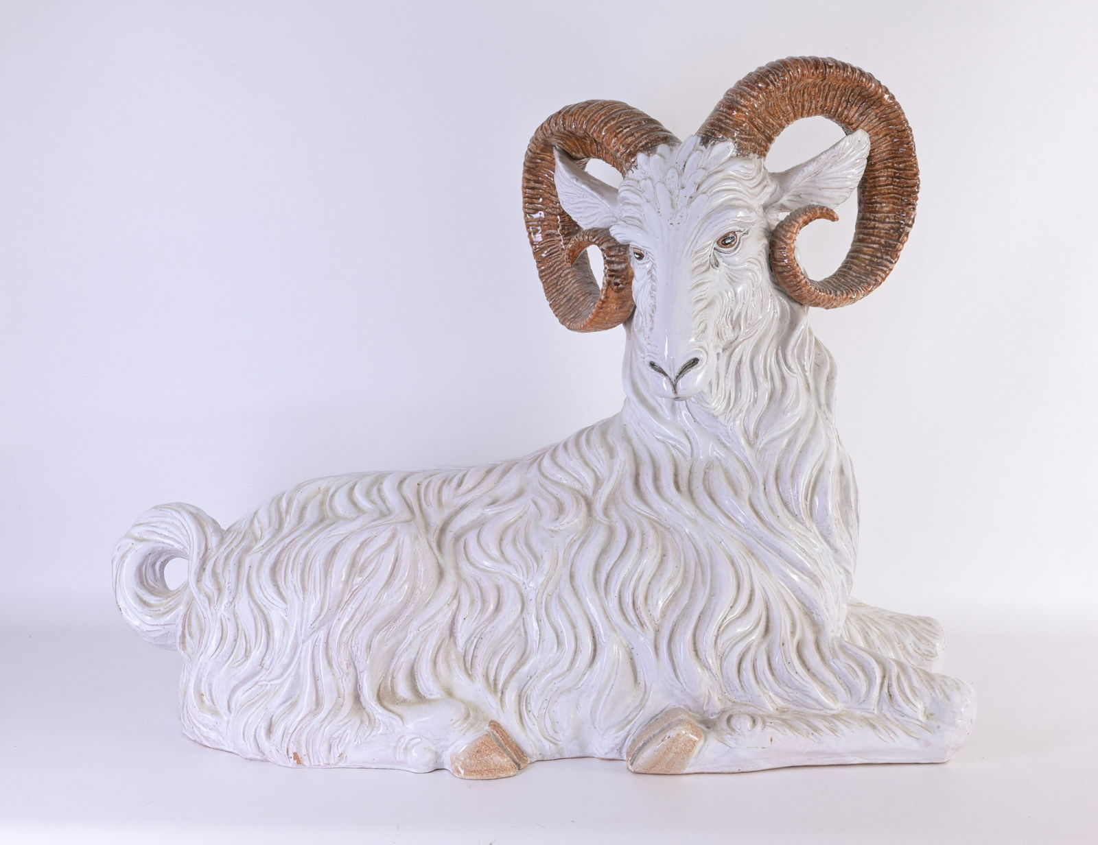 Italian Glazed Terracotta Figure of a Ram: Italian Glazed Terracotta Figure of a Seated Ram Dimensions: 23 x 29 x 13 in.