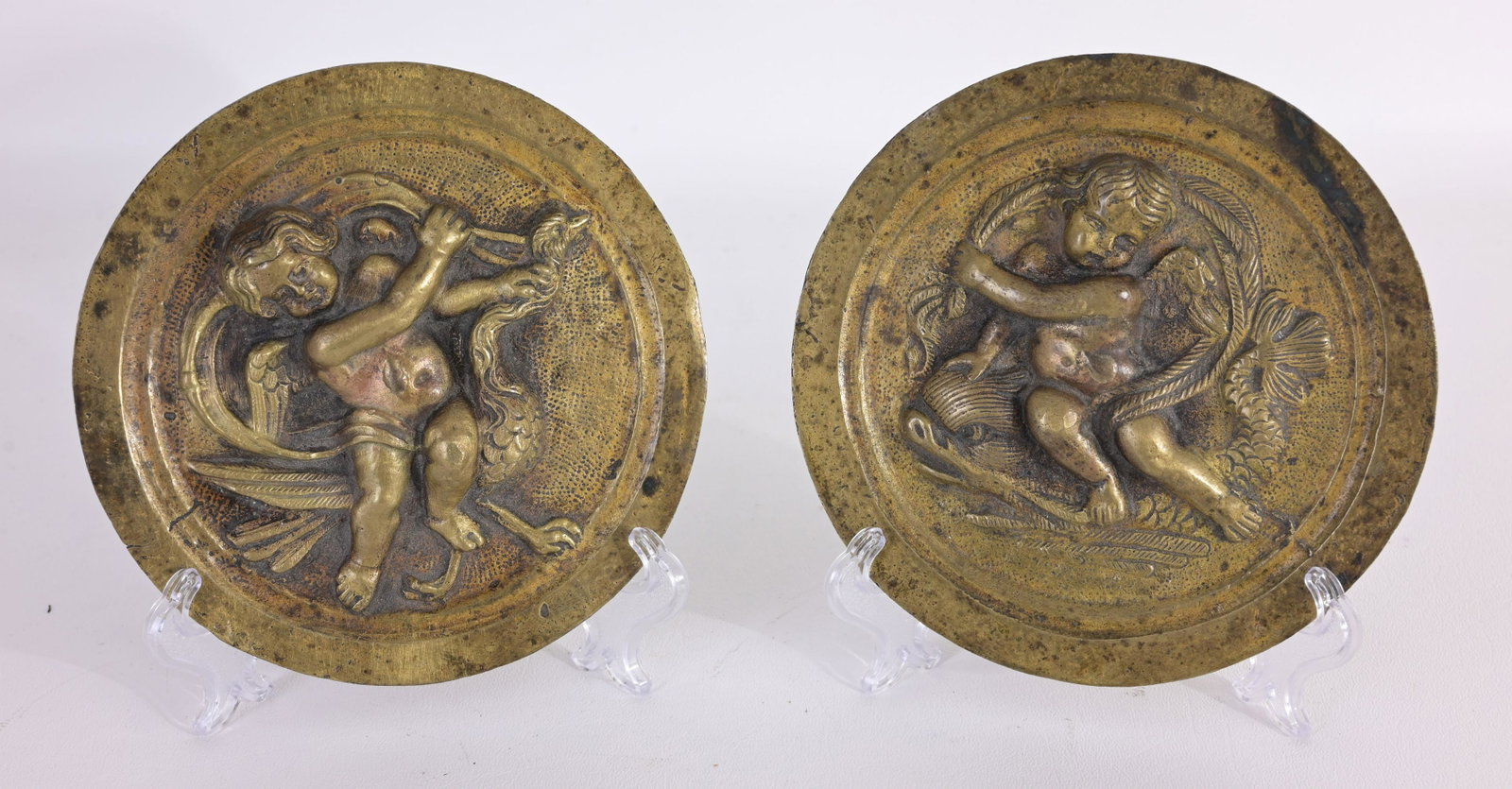 (2) French Louis XIV Brass Roundels: (2) French Louis XIV Brass Roundels Featuring Cherubs Diameters: 6 in.