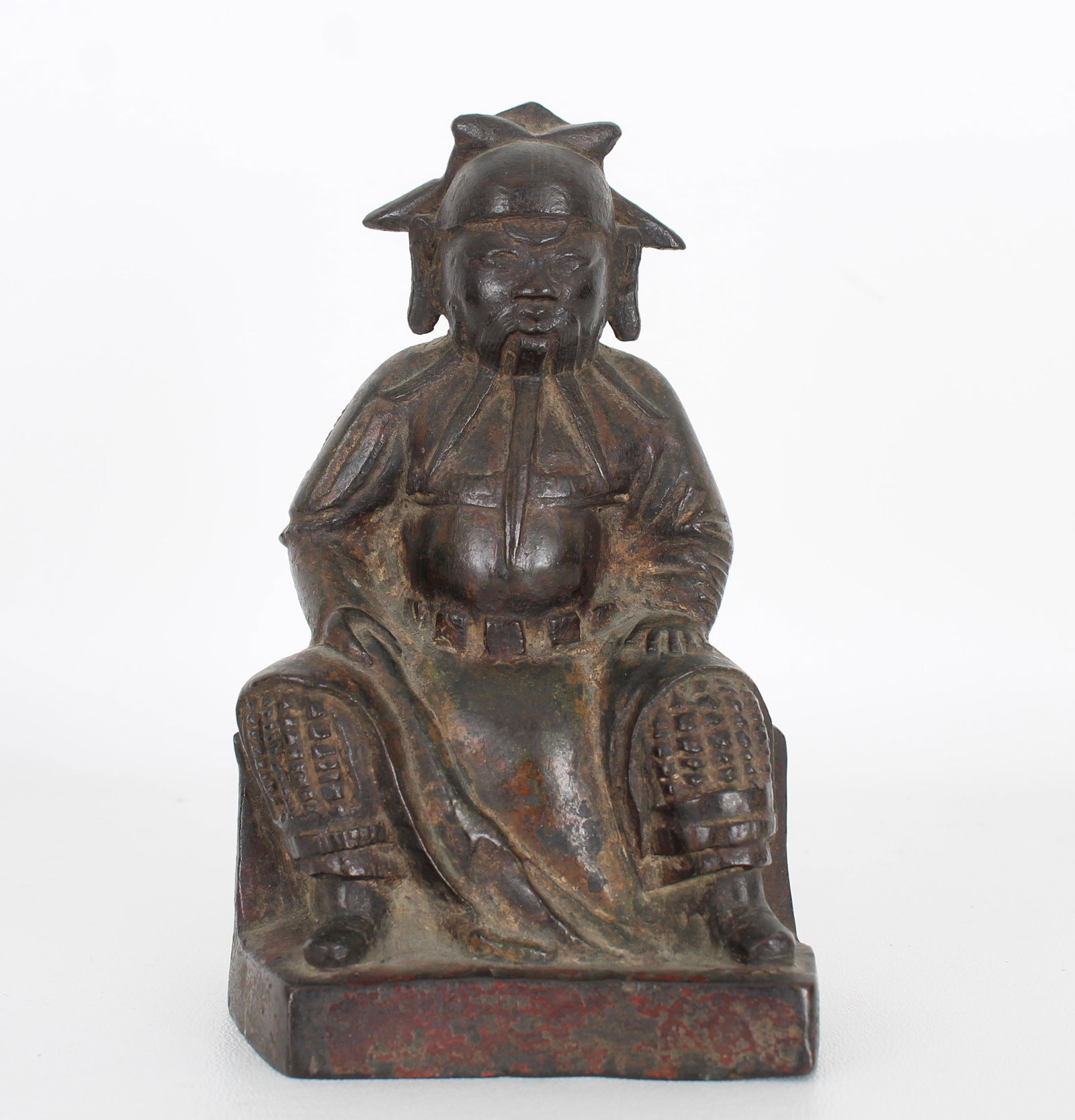 Early Antique Bronze Seated Figure: Early Antique Bronze Seated Figure. With remnants of original red paint throughout. Height: 6 in.