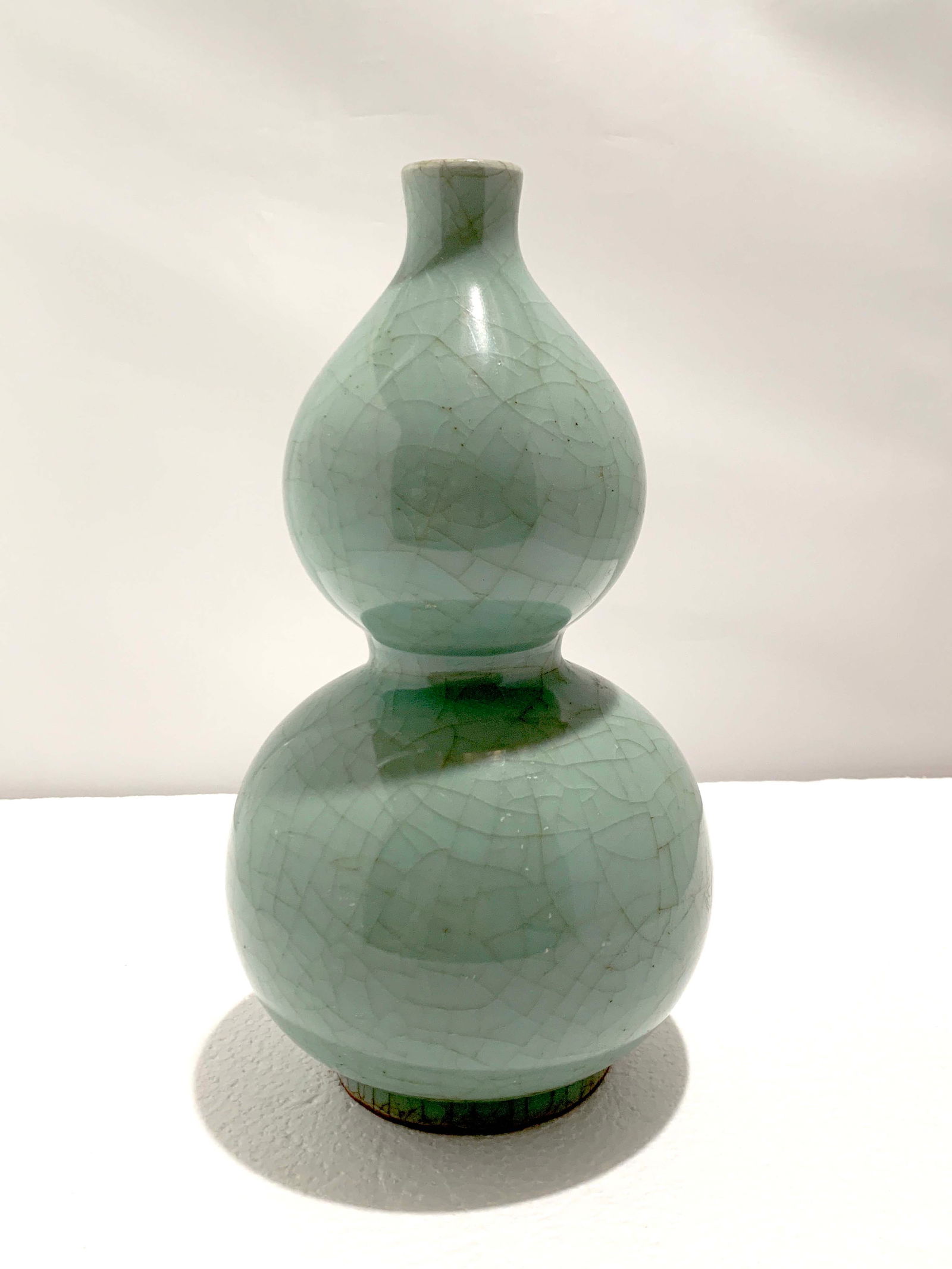 Chinese Longquan Double -Gourd Vase: A Chinese Longquan Double -Gourd Vase, probably Ming, H.25 cm Condition: chip to foot rim