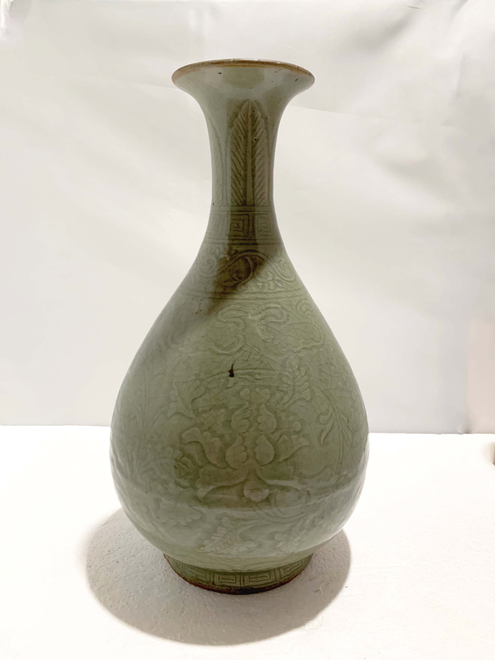 Chinese Carved Longquan Pear-shaped Vase: A Chinese Carved Longquan Pear-shaped Vase, Ming, H. 34 cm Provenance: Estate of the Lam's family from Hong Kong