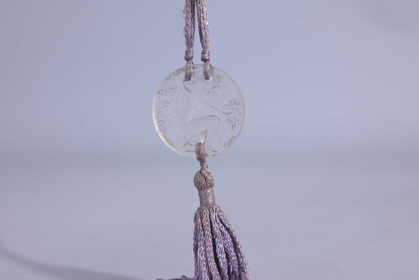 Rene Lalique Medallion Chose Promise Medallion: Rene Lalique Medallion Chose Promise Medallion. Female figure and having three holes for the attaching decorative cord and tassel Lalique Medallion made as a decoration attached to the outside of the 