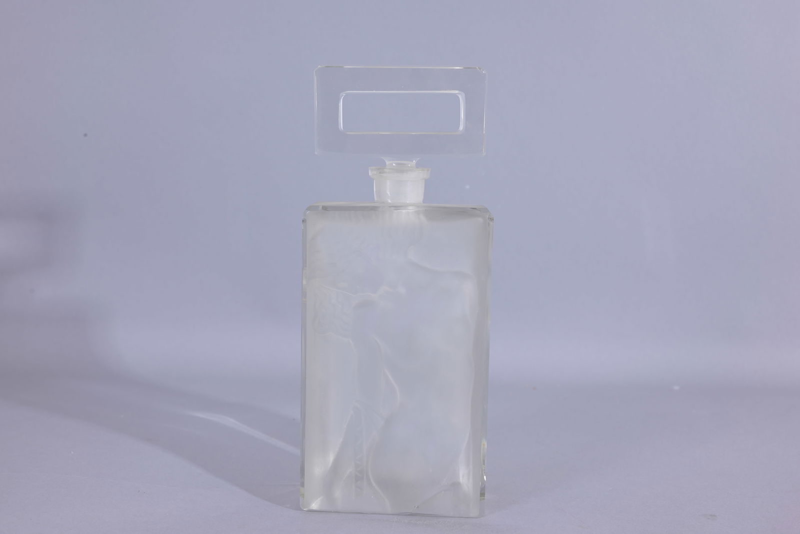 Ingrid Art Deco Frosted Perfume Bottle: Ingrid Art Deco Frosted Perfume Bottle with embossed Nude Woman on bottle sides. Original stopper. Clear/ frosted molded deco nude woman on bottle. (Czech - 17) Provenance: single owner lifetime colle