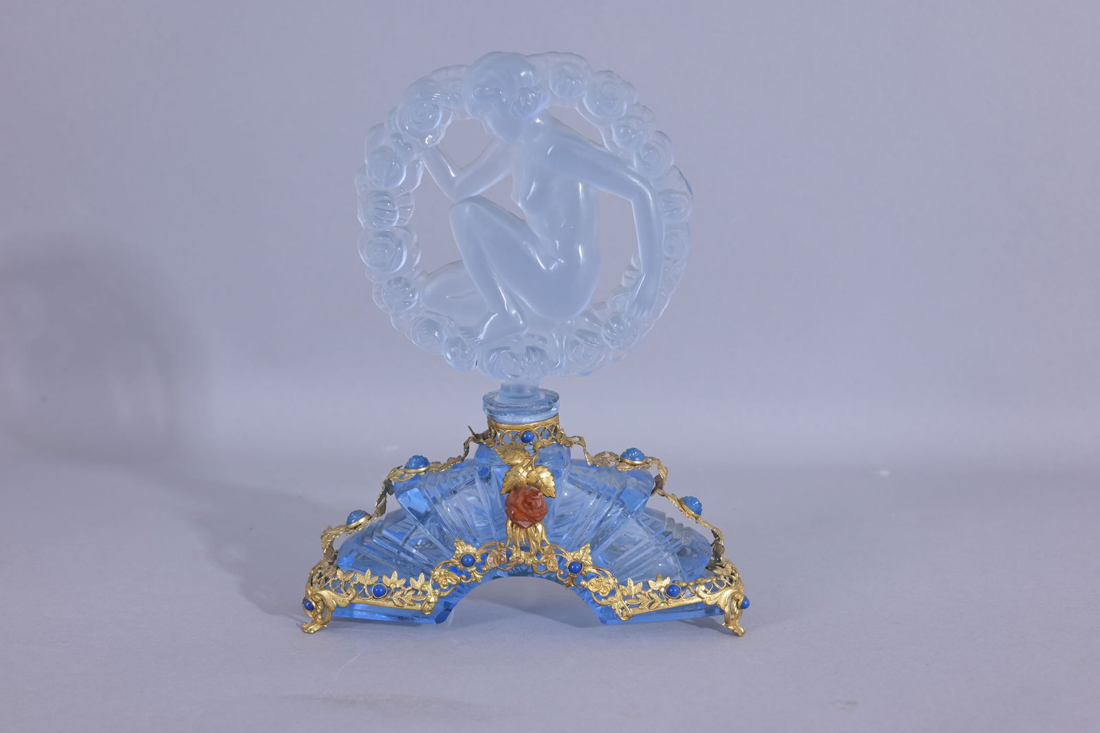 Vintage Czech Jeweled Perfume Bottle w/ Red Rose: Blue clear bottle with gold lace like jeweling. Small rose in the front, blue clear stopper, nude lady siting in a ring of roses. (Czech - 31) Provenance: single owner lifetime collection from Jackson