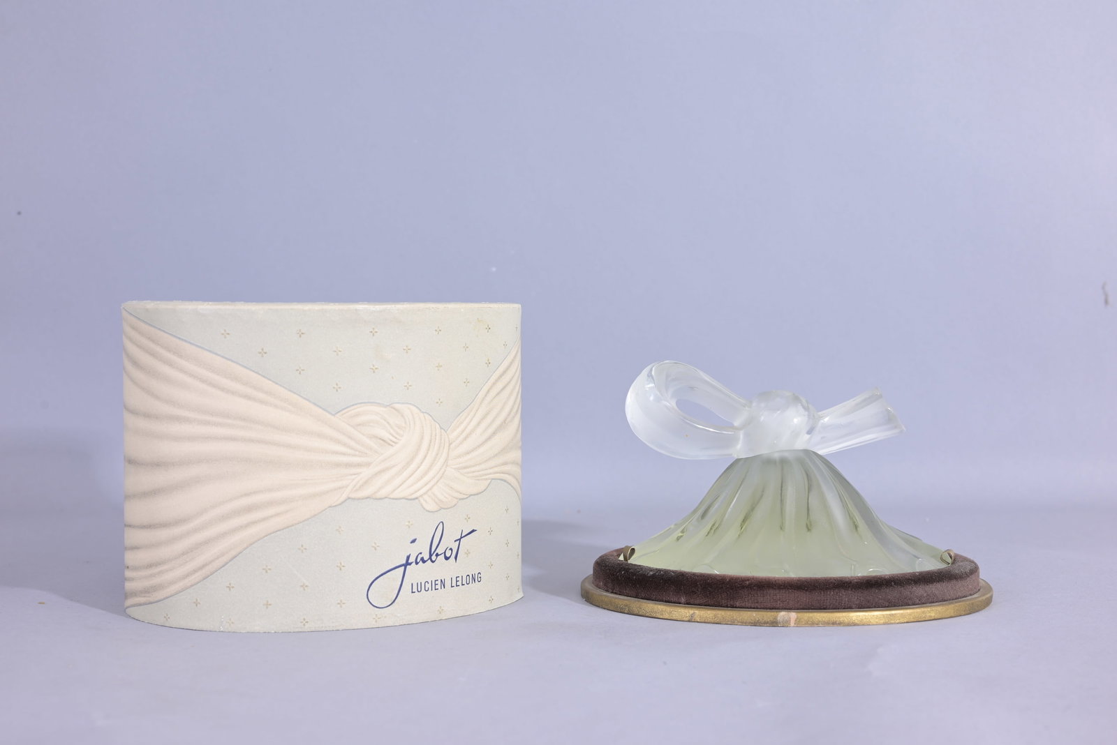 Lucien Lelong 'Jabot' frost glass perfume bottle: Lucien Lelong 'Jabot' frost glass perfume bottle with ribboned glass stopper in box. Circa 1939. (Lucien Lelong - 2) Provenance: single owner lifetime collection from Jacksonville, FL - Entire collect