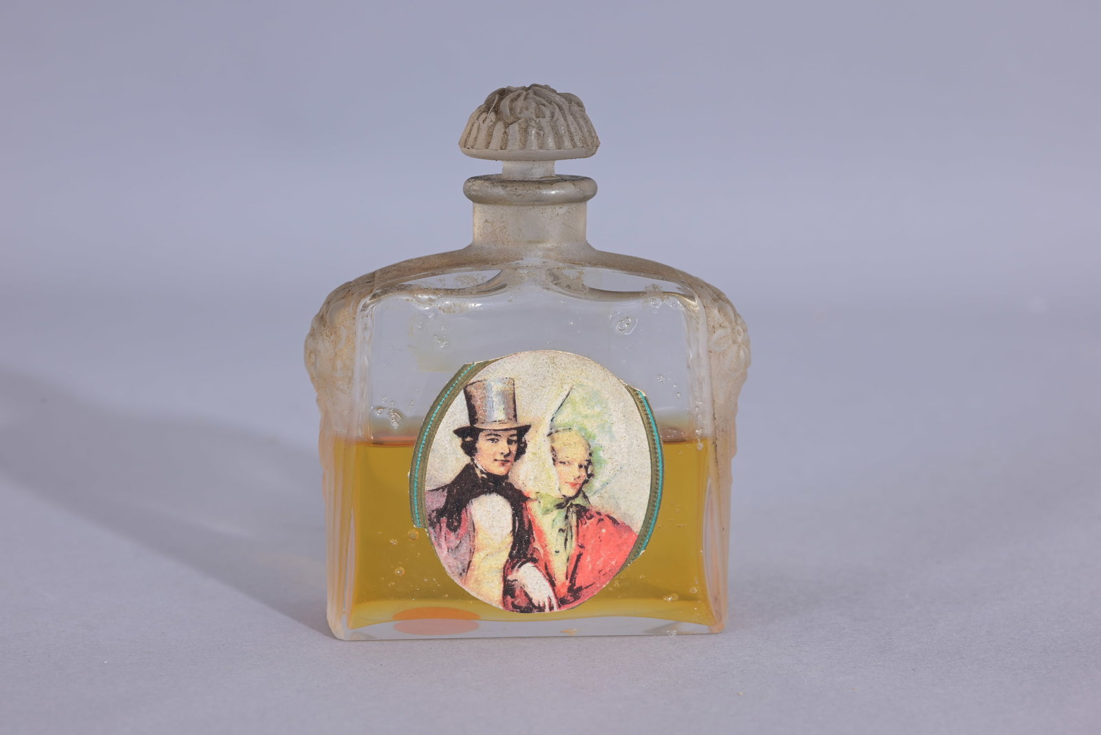 D'Orsay 'Lalique' Perfume Bottle w/ Rose Accents: Dorsay- Perfume bottle with an aplique in the front. possibly Lalique. (D'Orsay - 5) Provenance: single owner lifetime collection from Jacksonville, FL - Entire collection has been donated to St. Eliz