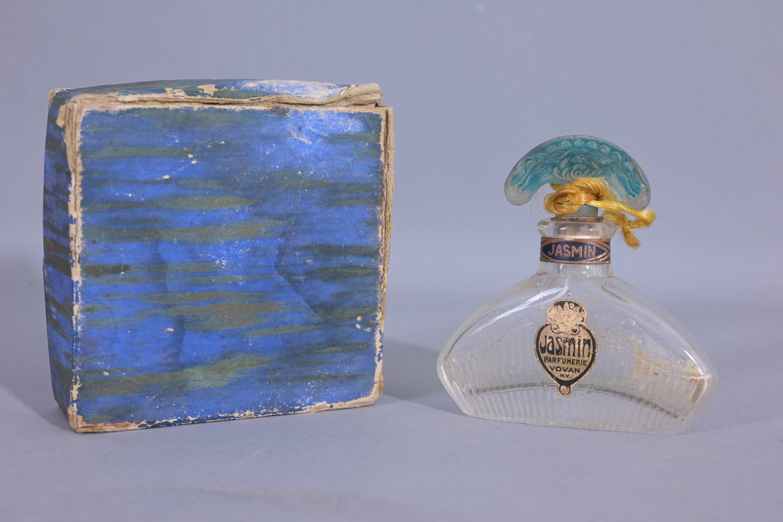 Vovan, Jasmin parfunerie glass bottle: Vovan, Jasmin parfunerie, clear ribbed bottle with green painted designed flacon in original box. (Misc - 67) Provenance: single owner lifetime collection from Jacksonville, FL - Entire collection has