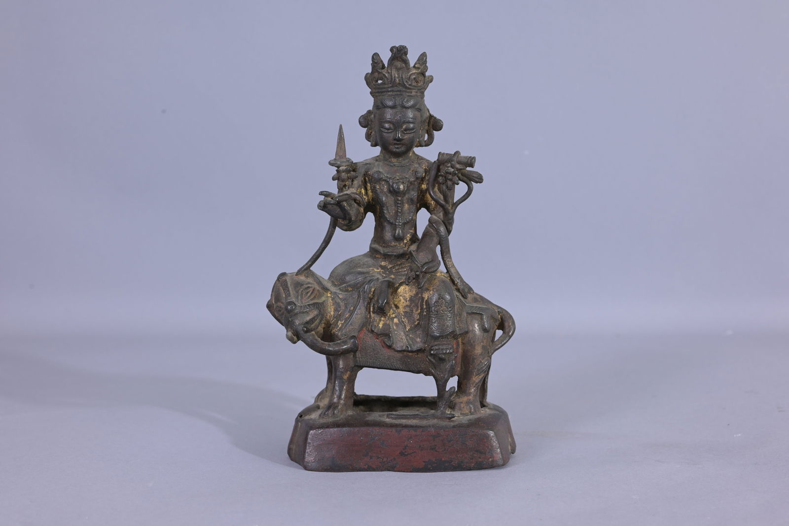 Early Antique Tibetan Bronze Figure on Elephant: Early Antique Tibetan Bronze Figure on Elephant. With remnants of original gilding throughout. Provenance: Estate of Francis Luis Mora (1874 - 1940). Height: 7 in.