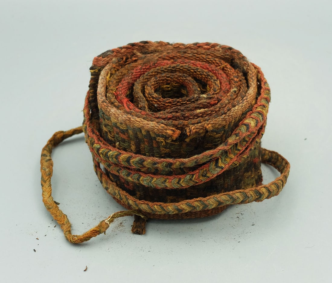 Colorful Textile Belt - Central Coast of Peru: A colorful textile belt from the Central Coast of Peru, probably Late Intermediate Period, ca. 1000 - 1450 AD. This fragile, intricately woven example is executed with geometric designs in a wide vari