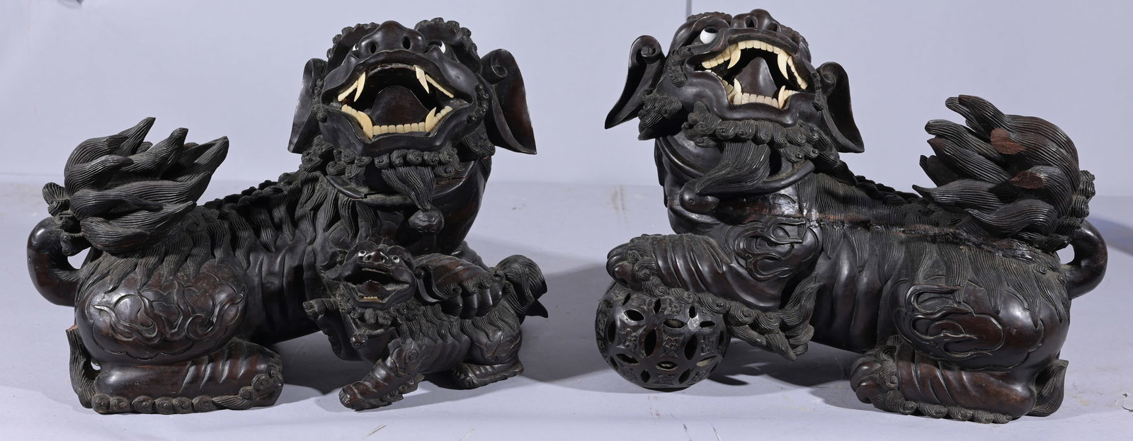 Pair of Wood Carved Chinese Foo Lions: Pair of Wood Carved Chinese Foo Lions Dimensions: 12.25 x 14 in.