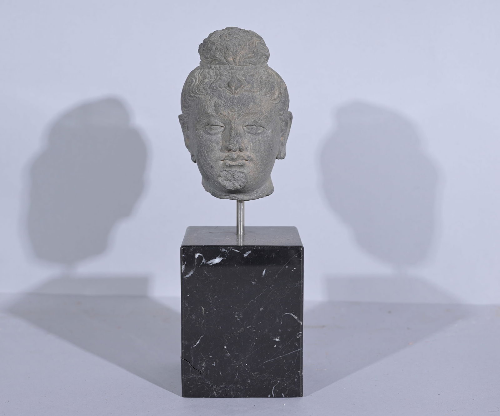Antique Gandharan Stucco Head on Stand: Antique Gandharan Stucco Head on Stand Height: 11 in.