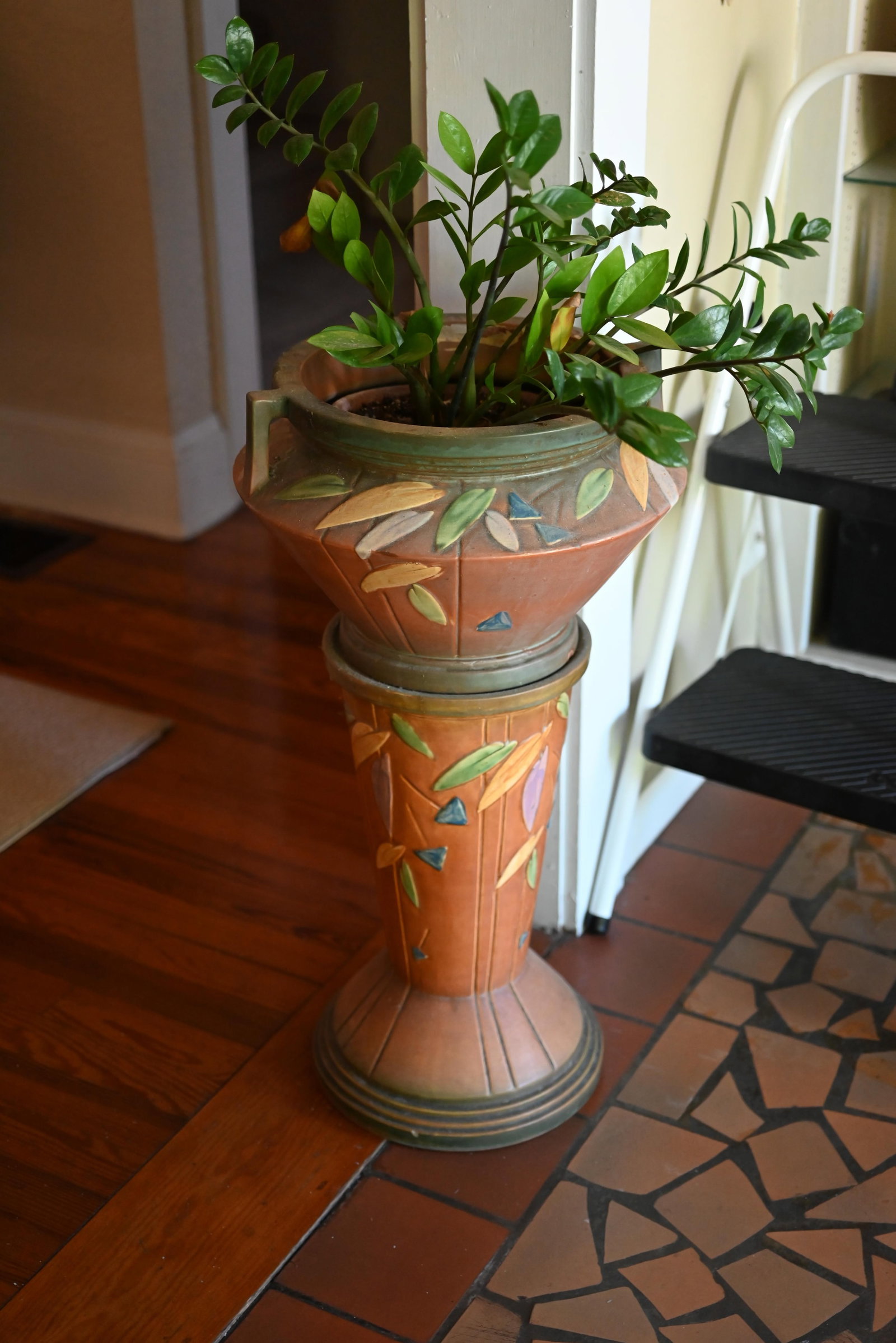 Roseville Pottery Futura Jardiniere & Pedestal: Roseville Pottery Futura Jardiniere & Pedestal. Roseville Pottery Futura Jardiniere & Pedestal. No. 616, large size with an orange body having green trim and colorful leaf decoration, jardiniere has 2