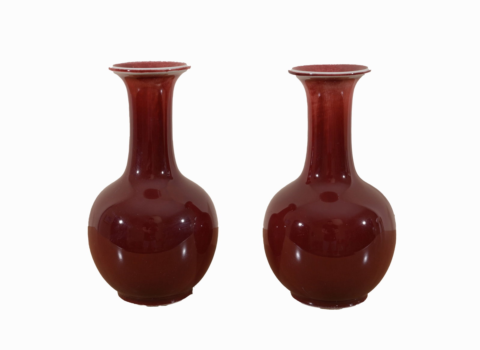 Pair, Chinese sang de boeuf vases, Marked: Chinese Art A pair of sang de boeuf porcelain vases Marked at the base Size: 8.5 in. Provenance: From the deceased estate of Jack Vinales (Sarasota, Florida)