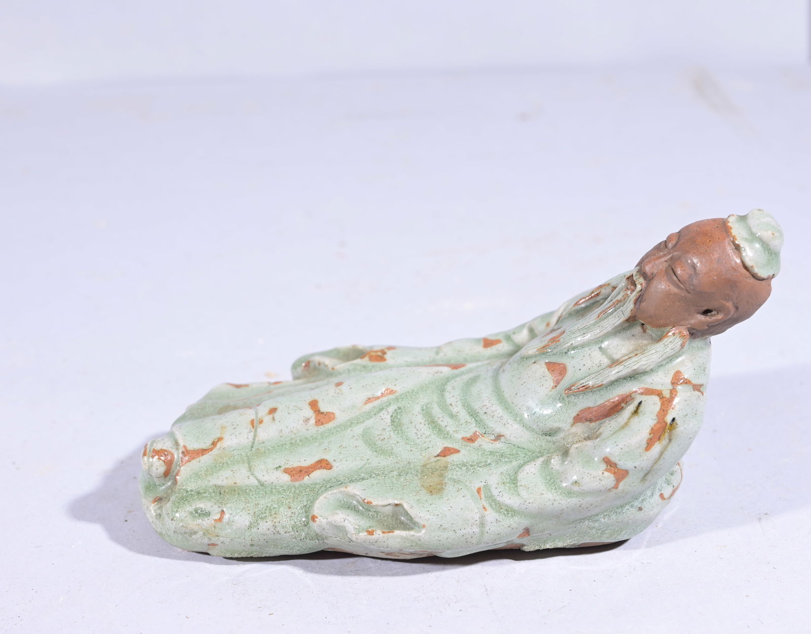 Chinese Reclining Mud Man Figure: Chinese Reclining Mud Man Figure Length: 7 in.