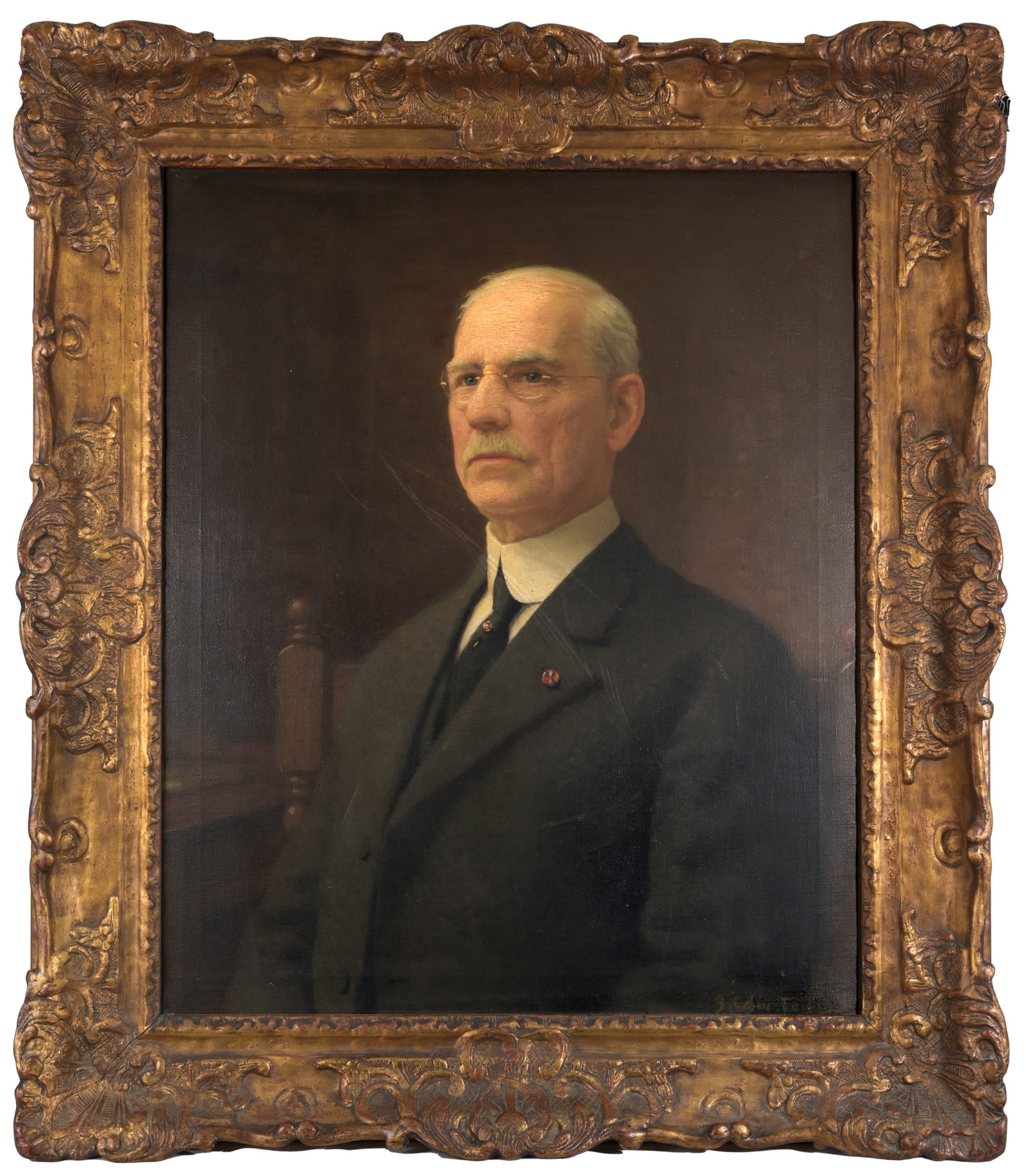 American School Portrait of a Man: American School Portrait of a Man Oil on Canvas Board. Signed lower right. Sight Size: 30 x 25 in. Overall Framed Size: 38 x 33 in.