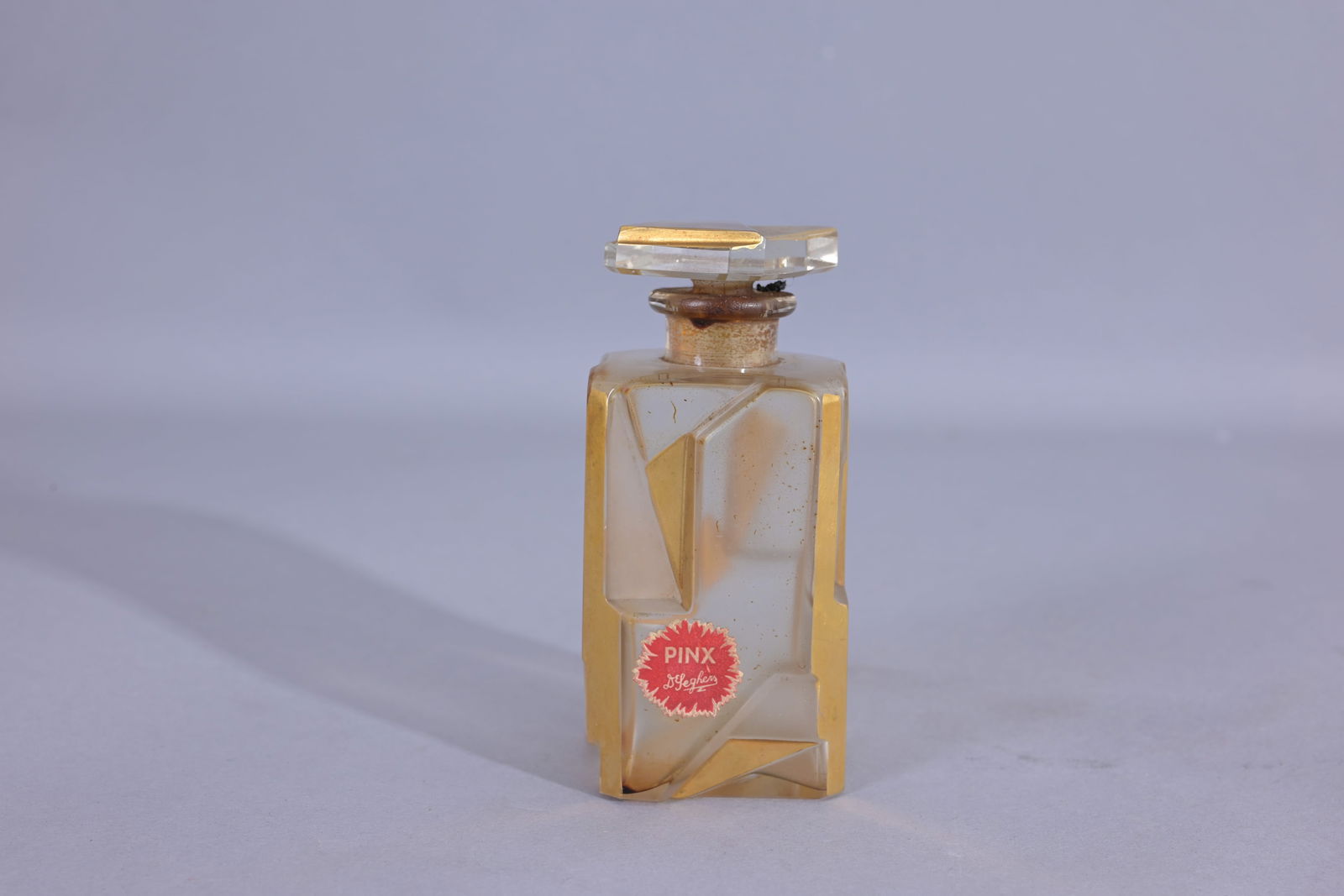 Vintage A Jollivet De Seghers Pinx Perfume Bottle: Vintage A Jollivet De Seghers Pinx Perfume Bottle. Clear and Frosted Bottle with Gold Abstract Geometric Design. Circa 1930s (Misc - 1033)