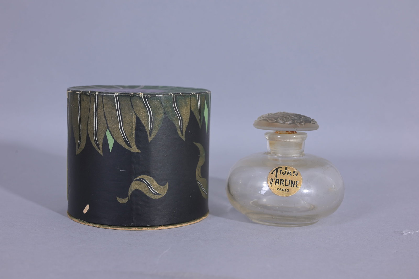 Tijane by D'Arline c1923 Perfume Bottle and Box: Tijane by D'Arline c1923 Perfume Bottle and Box. Vintage Tijan perfume bottle by the American Druggist Syndicate in Long Island New York in 1924. Presented in its beautiful cylindrical drum-shaped car