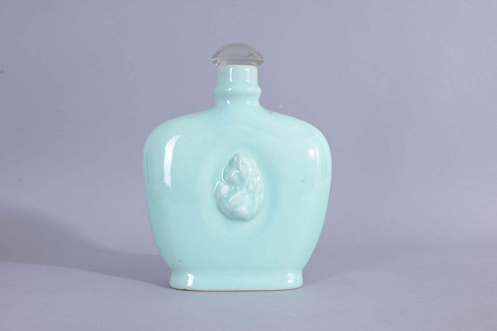 Spirits of Perfume by LOrle Pottery Perfume Bottle: Spirits of Perfume - Argentina, L'Orle, circa 1940. The "Spirits of Perfume" collection included four perfumes housed in pastel glazed pottery flasks molded with a cameo on the front. (Misc - 1055)