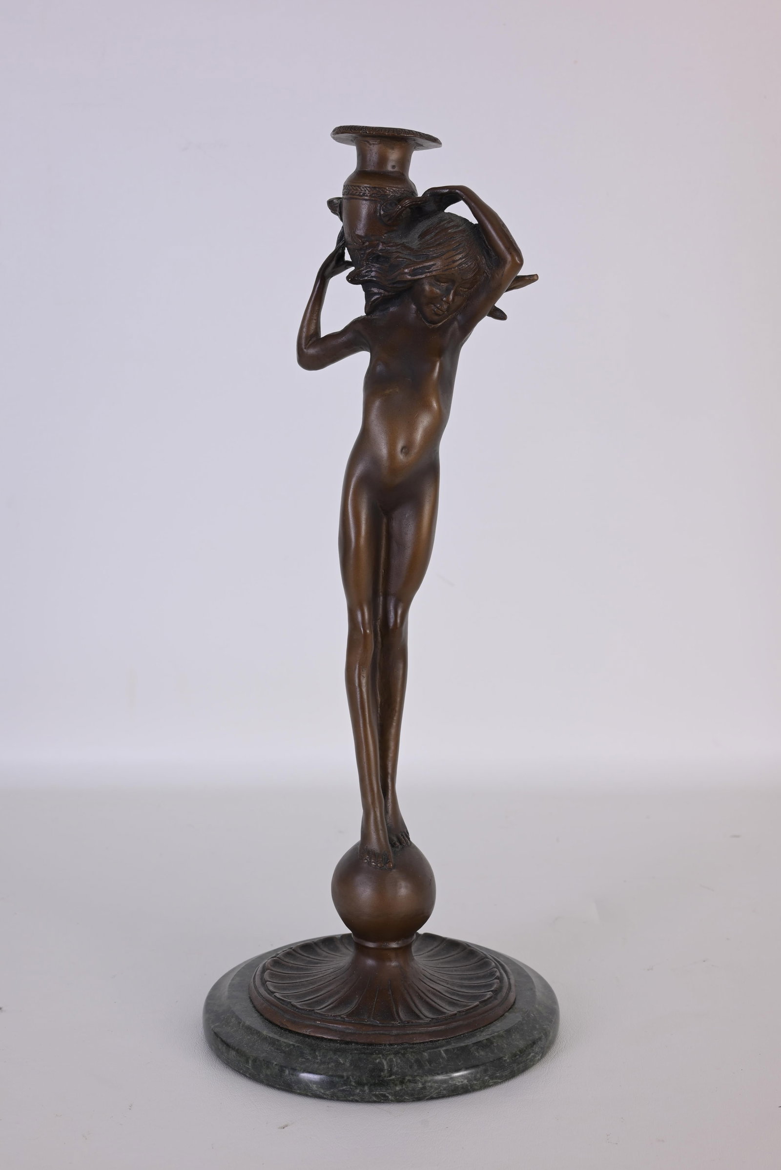 After Edward McCartan "Waterbearer" Bronze: After Edward McCartan (American, 1879 - 1947) Waterbearer candleholder Signed near base. Dimensions: 17 1/8 x 7 in.