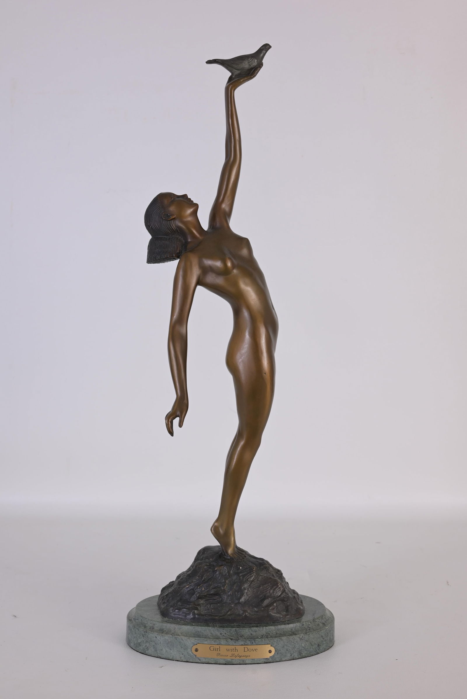 After Pierre Le Faguays "Girl with Dove" Bronze: After Pierre Lefaguays (French, 1892 - 1962) "Girl with Dove" - Bronze Signed near base. Dimensions: 22.5 x 8 x 5 in.