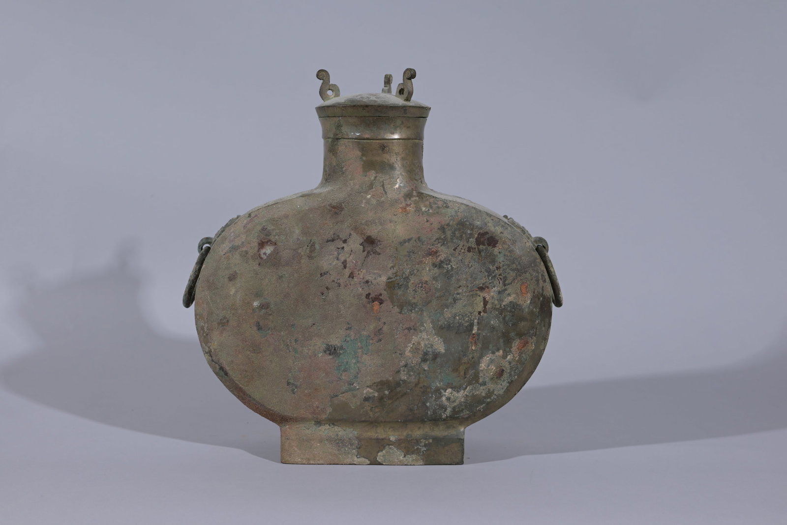 Early Bronze Flattened Wine Vessel & Cover, Bianhu: Early Antique Northern Chinese Bronze Flattened Wine Vessel & Cover, BIANHU Height: 13 in. - Provenance: this item comes from the private collection of Lou A. and Barbara B. Pritchett. Lou Pritchett w