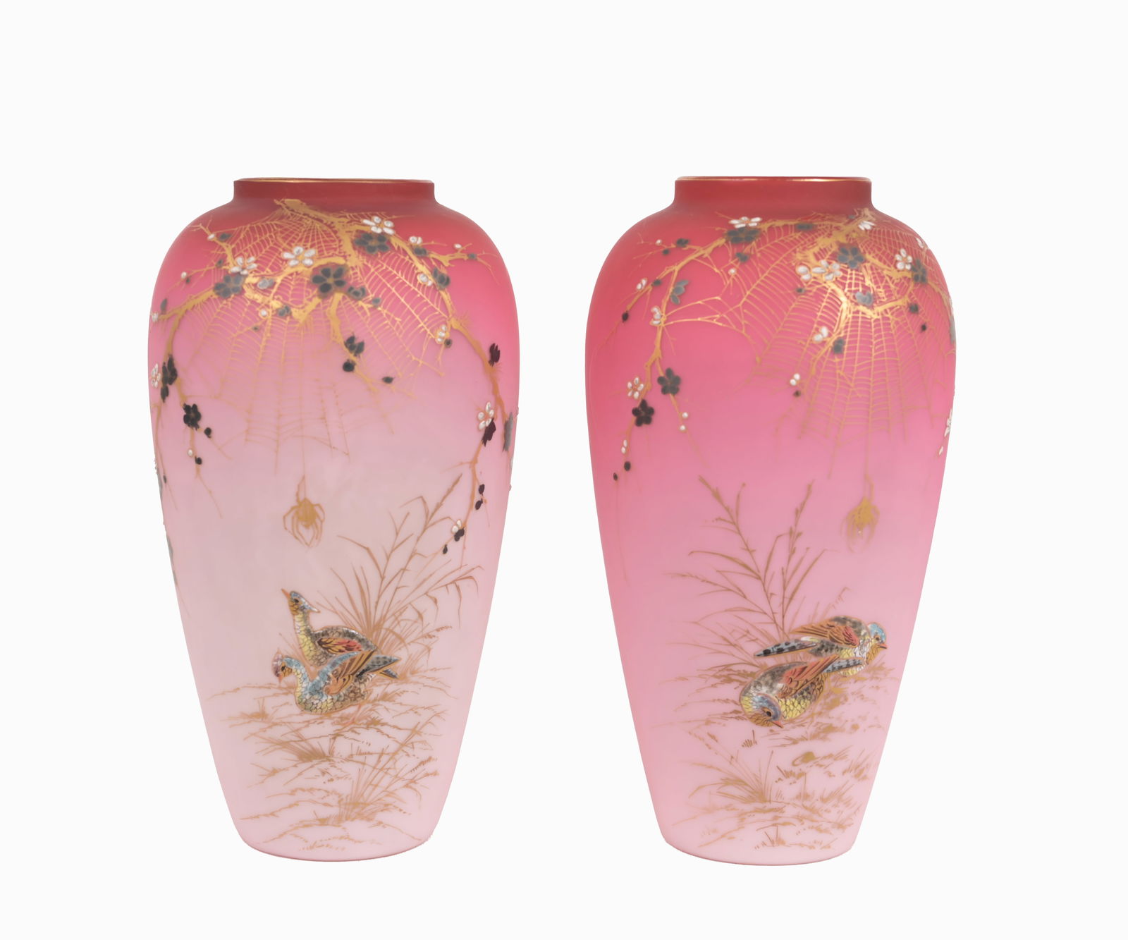 Pair, Thomas Webb Peachblow Glass Vases: Thomas Webb, Stourbridge, England, c. 1880 decorated with raised burnished gilding of bird, spider web and spider design. Inscribed on bottom of each vase. Height: 10.75 in.
