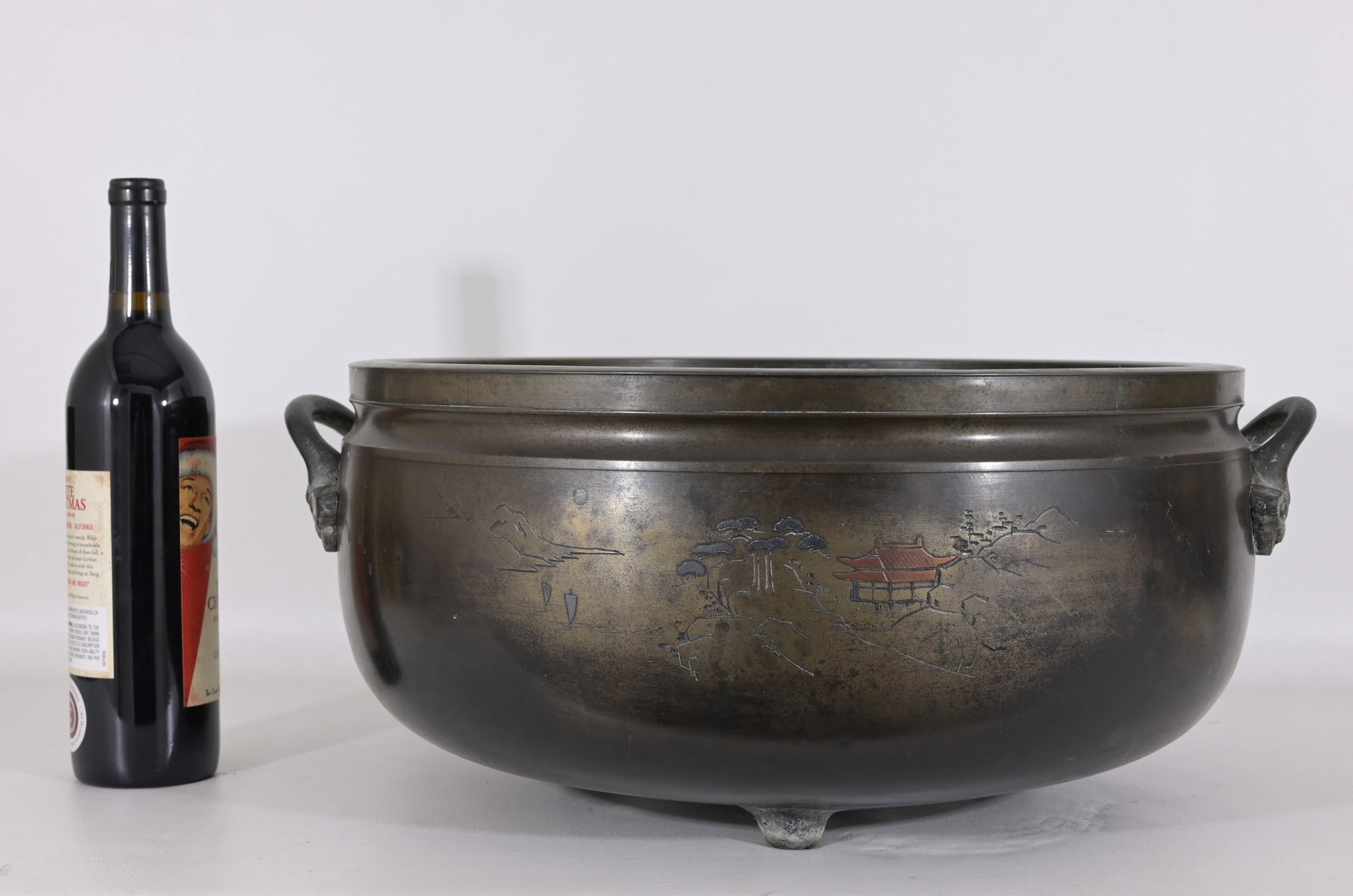 Antique Chinese Bronze Censer: Antique Chinese Bronze Censer with a Pavillion depicted on the exterior. Provenance: From the estate of the ex- Vice President of Procter and Gamble, Lou Pritchett. Height: 8.75 in. Diameter: 17 in.