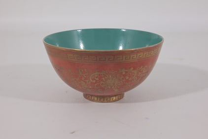 Chinese gilt decorated coral ground bowl