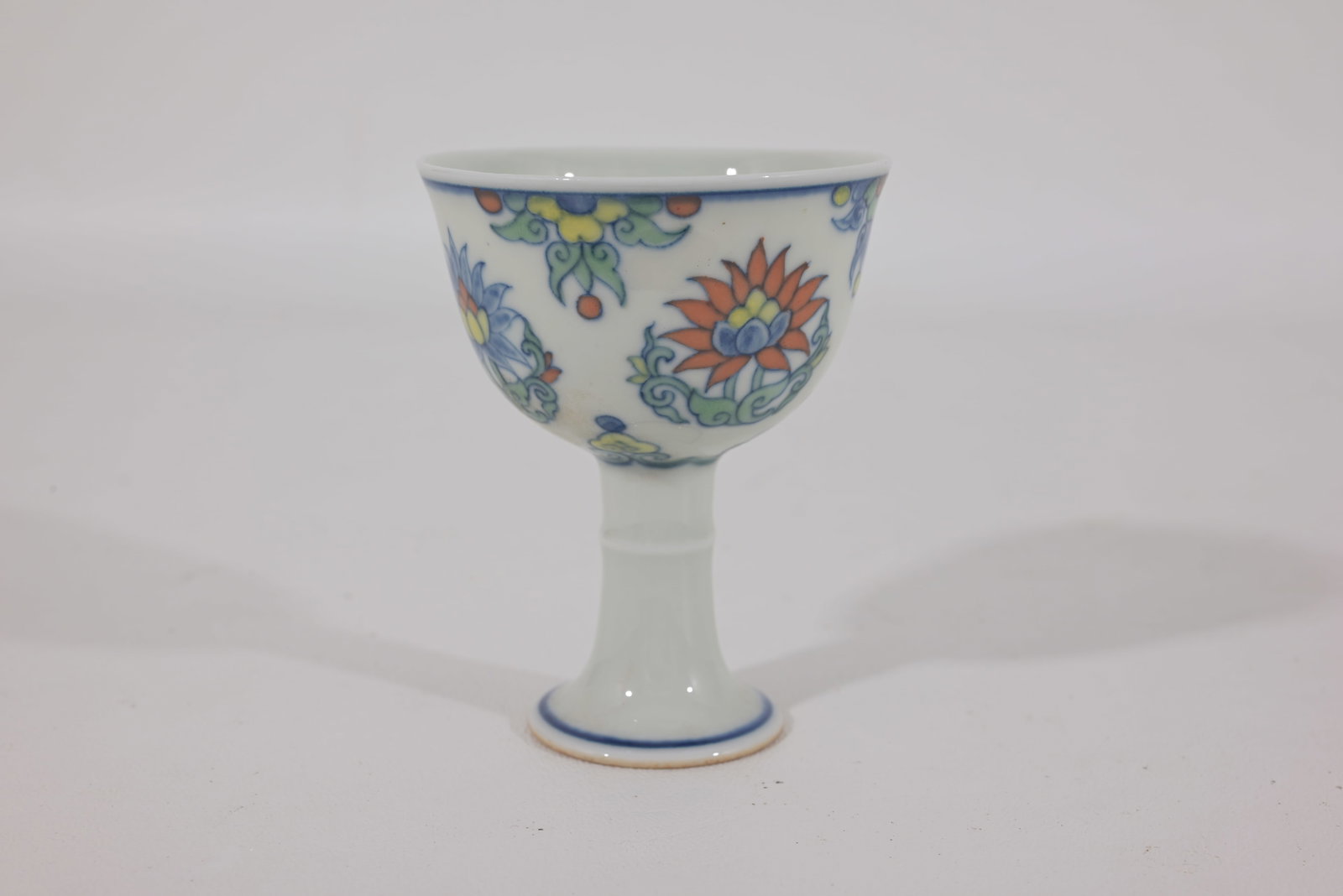 Chinese Doucai wine cup, marked: A Chinese Doucai wine cup, marked, H. 7.8 cm Condition: scratches and stains, otherwise in good condition