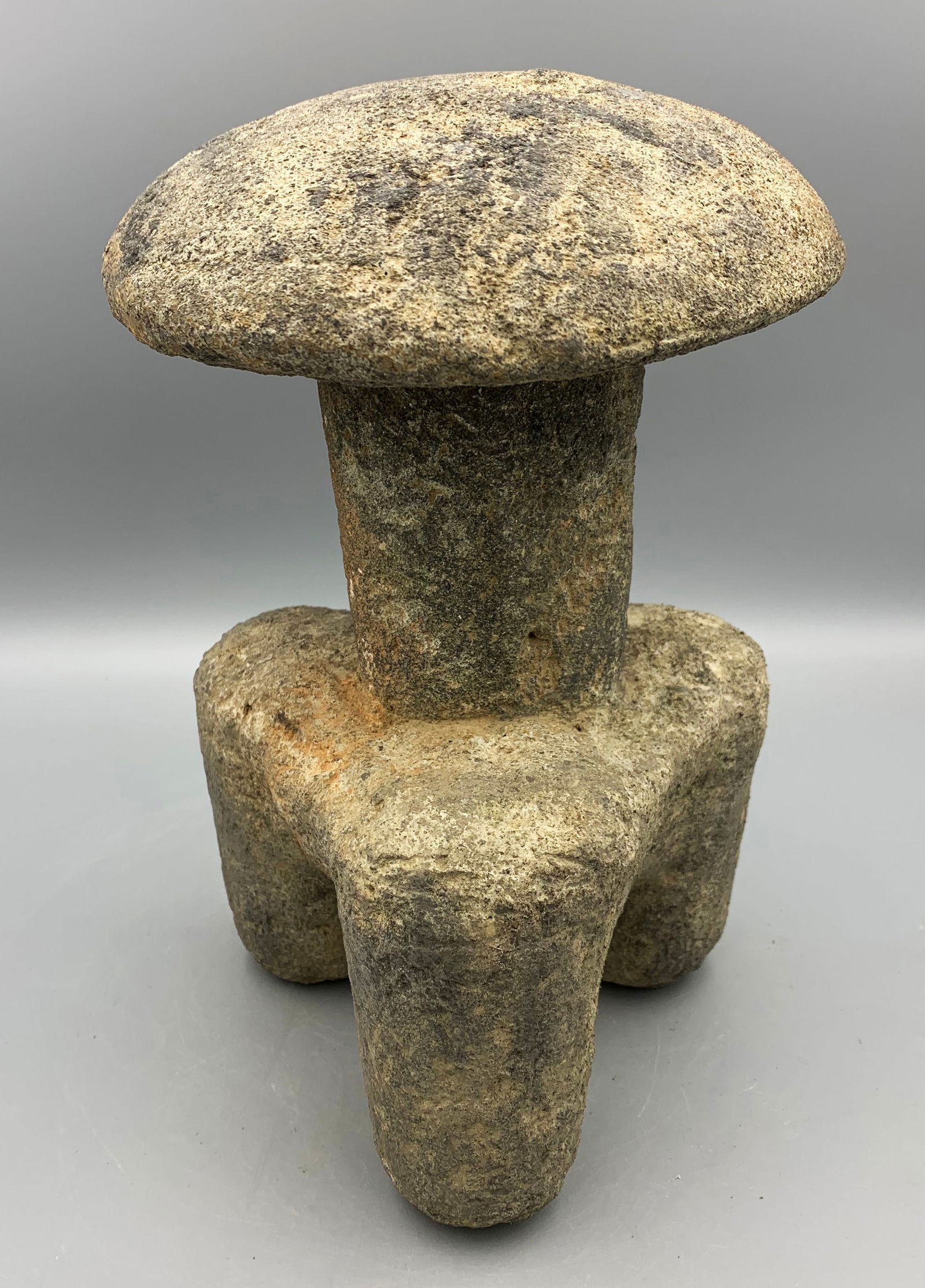 vintage Maya mushroom sculpture from Guatemala: A vintage Maya mushroom sculpture from Guatemala, 10-1/2 in. high. It is carved from heavy volcanic stone and is covered with pigment remnants and strong mineral deposits. Intact. (MA2092)