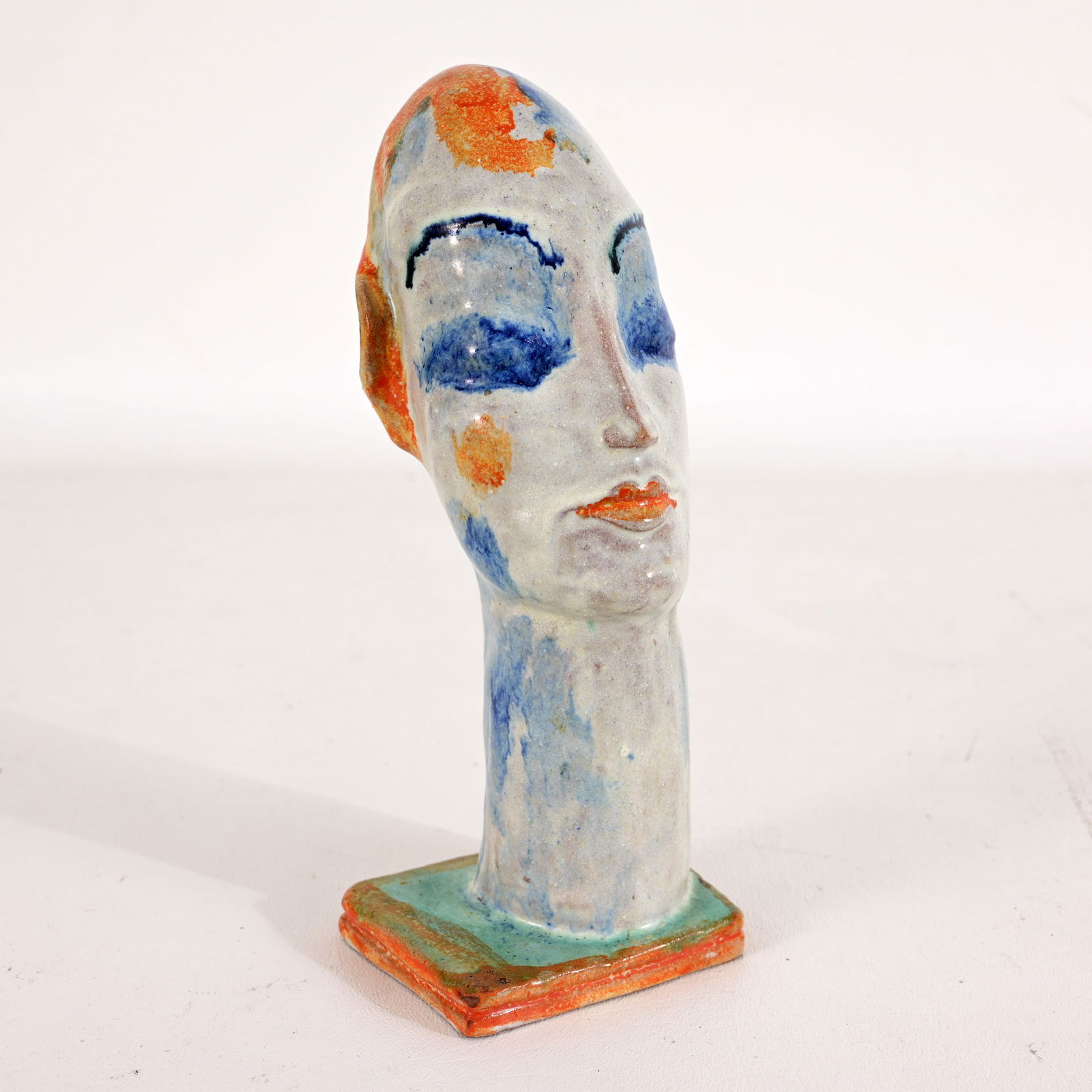 Gudrun Baudisch (Austrian, 1907 - 1982): Gudrun Baudisch-Wittke (Austrian, 1907 - 1982) Glazed Terra Cotta Bust of a Woman for Wiener Werkstatte. Marked on base. Dimensions: 7.5 x 3 x 3.75 in.