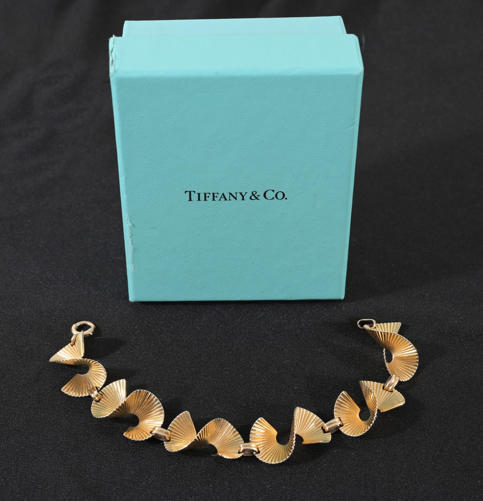 Tiffany & Co. 14K Gold George Schuler Bracelet: Tiffany & Co. 14K Gold George Schuler Bracelet. Stamped on clasp. Length: 7.25 in. Weight: 16.2 g.