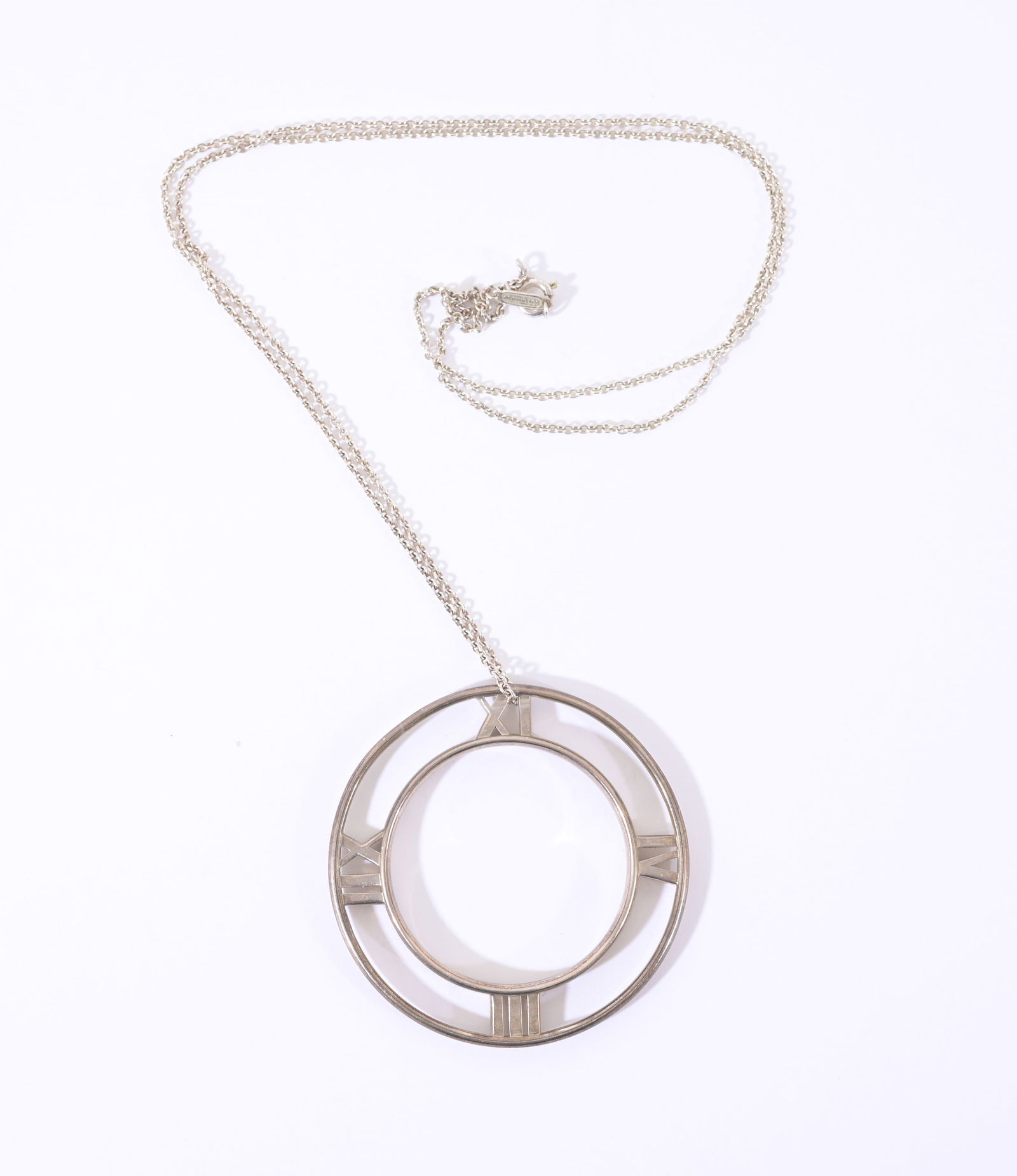 Tiffany & Co Sterling Atlas Pendant and Chain: Tiffany & Co Sterling Silver Atlas Pendant and Chain. Both pieces hallmarked Tiffany. Pendant Diameter: 2 in. Overall Weight: 17.2 g