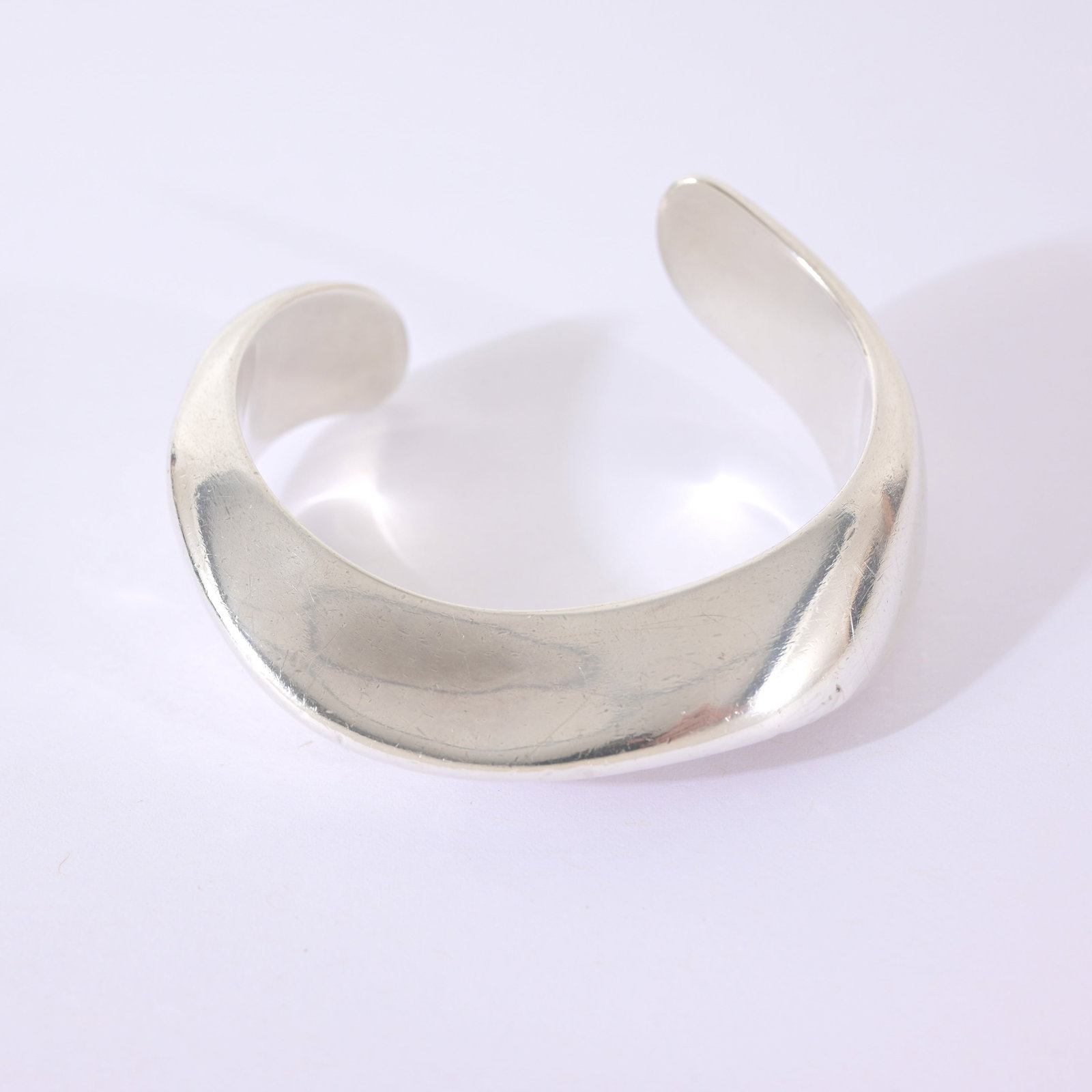 Elsa Peretti Sterling 'Swirl Cuff' Bangle: Elsa Peretti Sterling 'Swirl Cuff' Bangle. Hallmarked inside band. Comes with Tiffany Blue pouch. Total Weight: 39.2 grams.