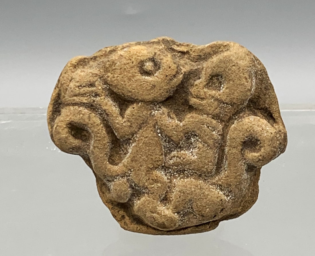 Maya Stamp Seal - Guatemala: A rare Maya stamp seal from Guatemala, ca. 200 - 600 AD. It is 2-1/8 in. wide and depicts a pair of entwined monkeys, one of which has a skull head. Intact, good mineral deposits. (XSS11)