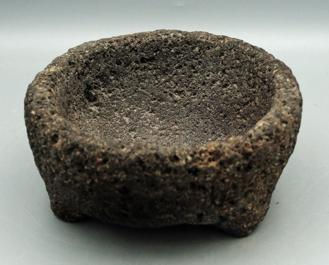Stone Grinding Bowl from Costa Rica: A fine stone grinding bowl from Costa Rica, ca. 500 - 1000 AD. This nice tripod vessel from the Atlantic Watershed region is 6-3/4" in diameter and is made from a hard volcanic stone. Its interior and