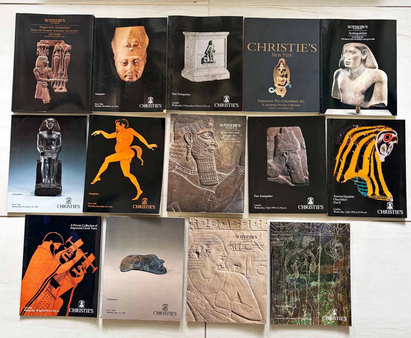 group of 14 Sotheby's and Christie's catalog: A group of 14 Sotheby's and Christie's catalogs, 1992 - 1993, New York and London. They feature Antiquities, Egyptian and Islamic art, many come with the prices realized lists. All are in excellent co