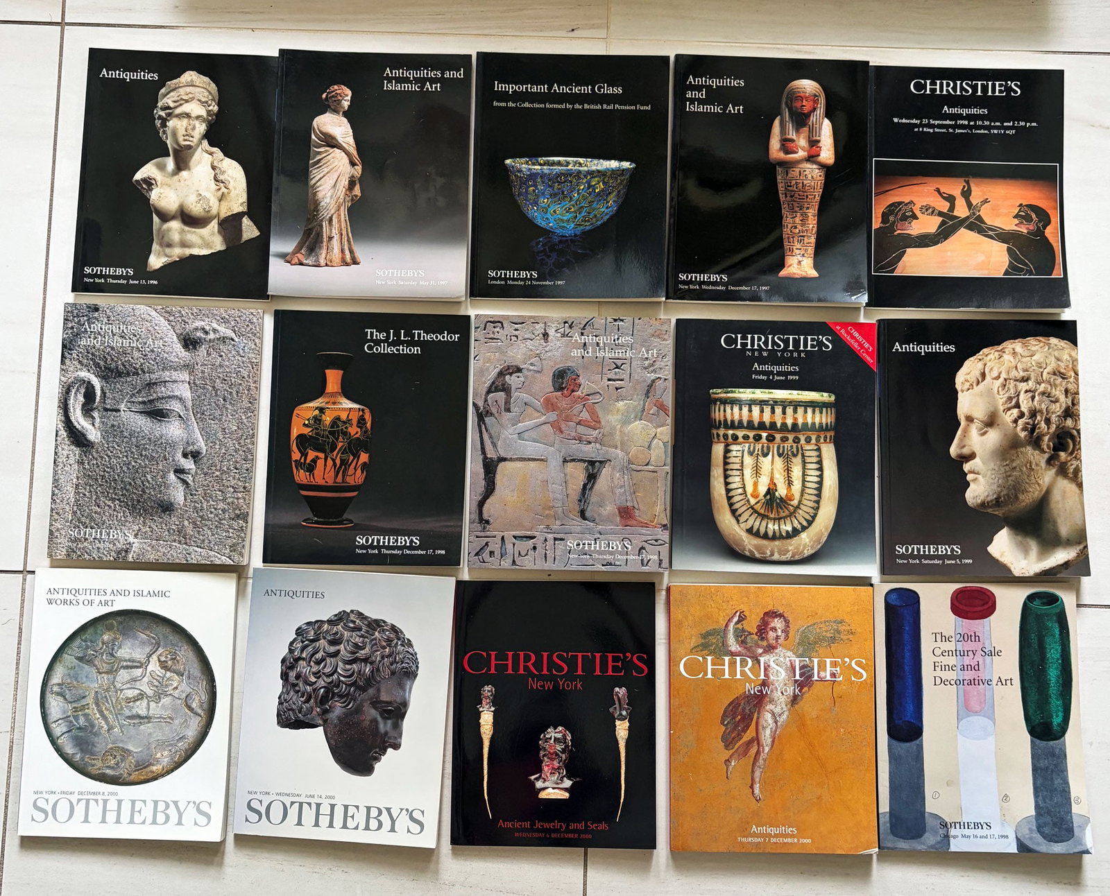 group of 15 Sotheby's and Christie's catalogs: A group of 15 Sotheby's and Christie's catalogs, 1996 - 2000, New York and London. They feature Antiquities, Egyptian and Islamic art, many come with the prices realized lists. All are in excellent co