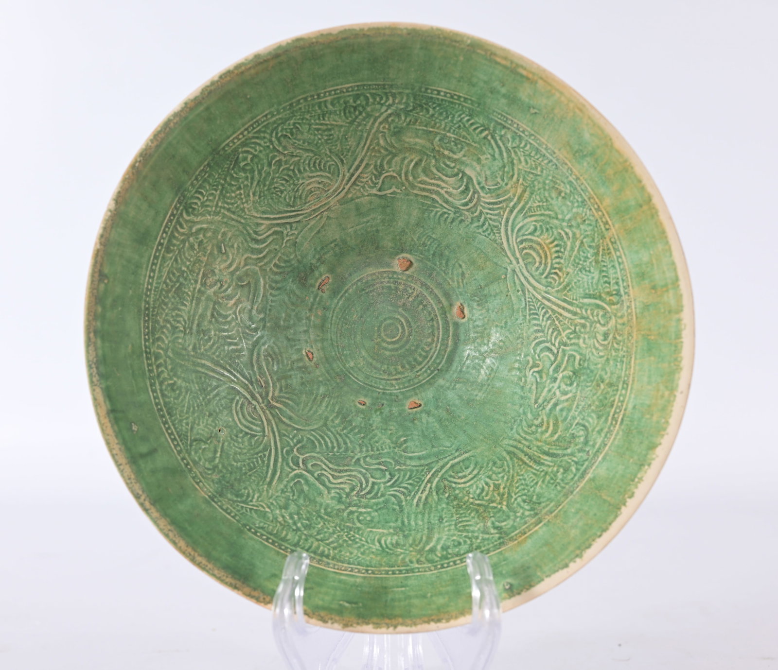 Early Vietnamese green-glazed stoneware bowl: Early Antique Vietnamese monochrome green-glazed incised stoneware bowl dating from the Tran to Le dynasties (around the 14th to 15th century) Diameter: 7 in.