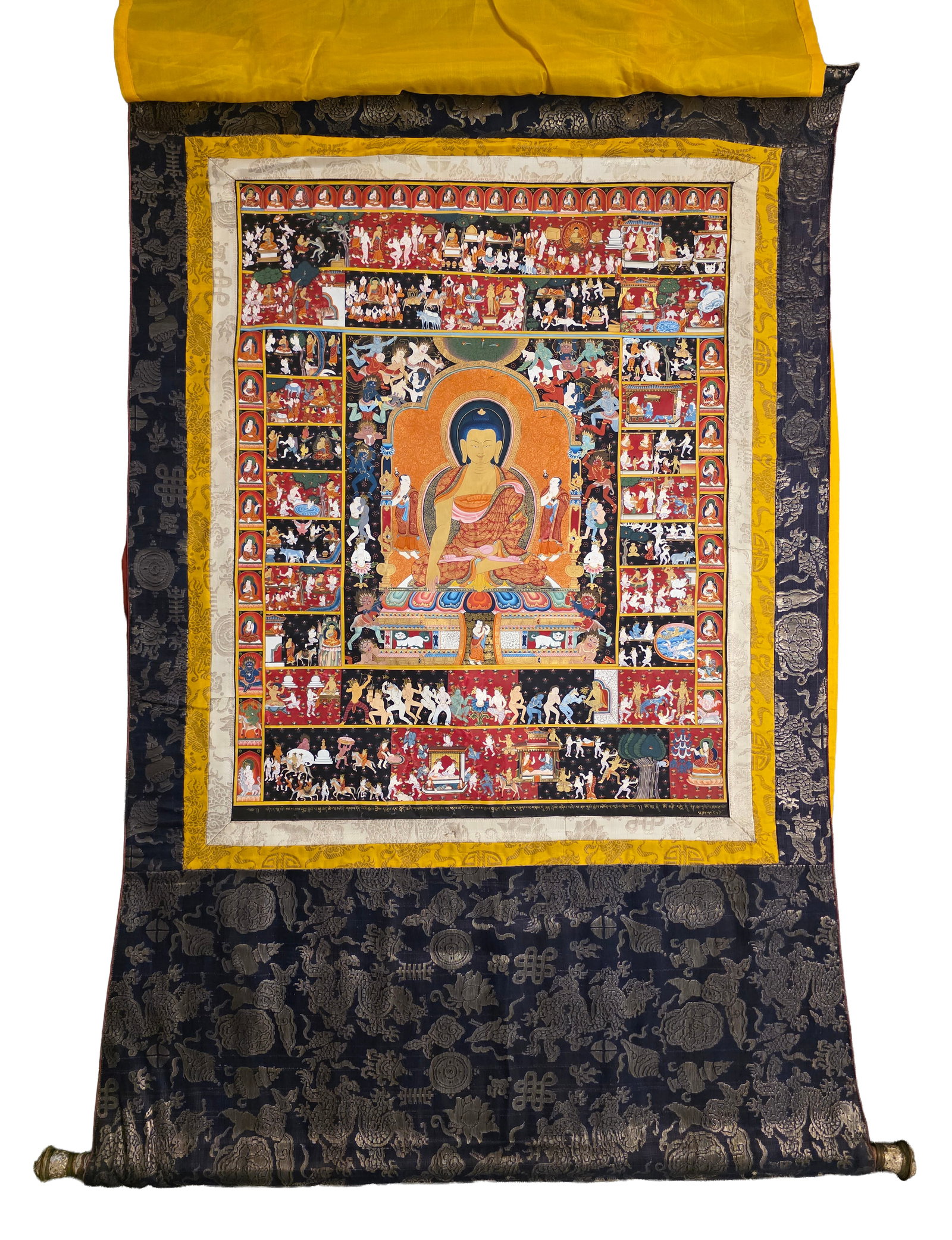 Monumental-Life Story of Shakyamuni Buddha Thangka: Monumental sized Life Story of Shakyamuni Buddha Thangka. The central, dominant figure is Shakyamuni Buddha seated on a lotus throne. He is shown performing the Bhumisparsha mudra (earth-touching