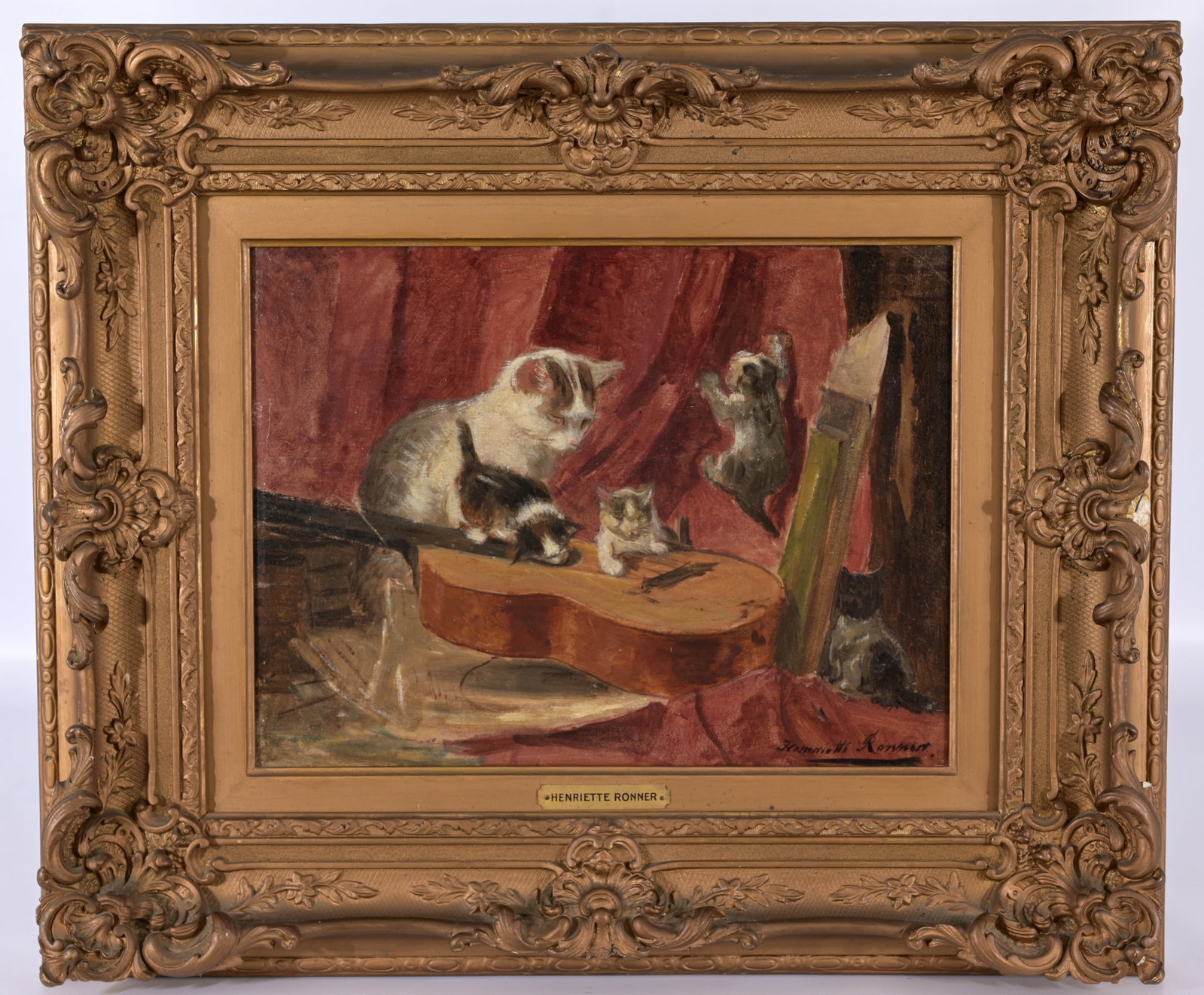 Henriette Ronner-Knip (Dutch, 1821 - 1909): Henriette Ronner-Knip (Dutch, 1821 - 1909) "Making Music" Oil on Paper laid on Board. Signed lower right. Old note verso. Sight Size: 10.5 x 14 in. Overall Framed Size: 19 x 22.5 x 3 in.